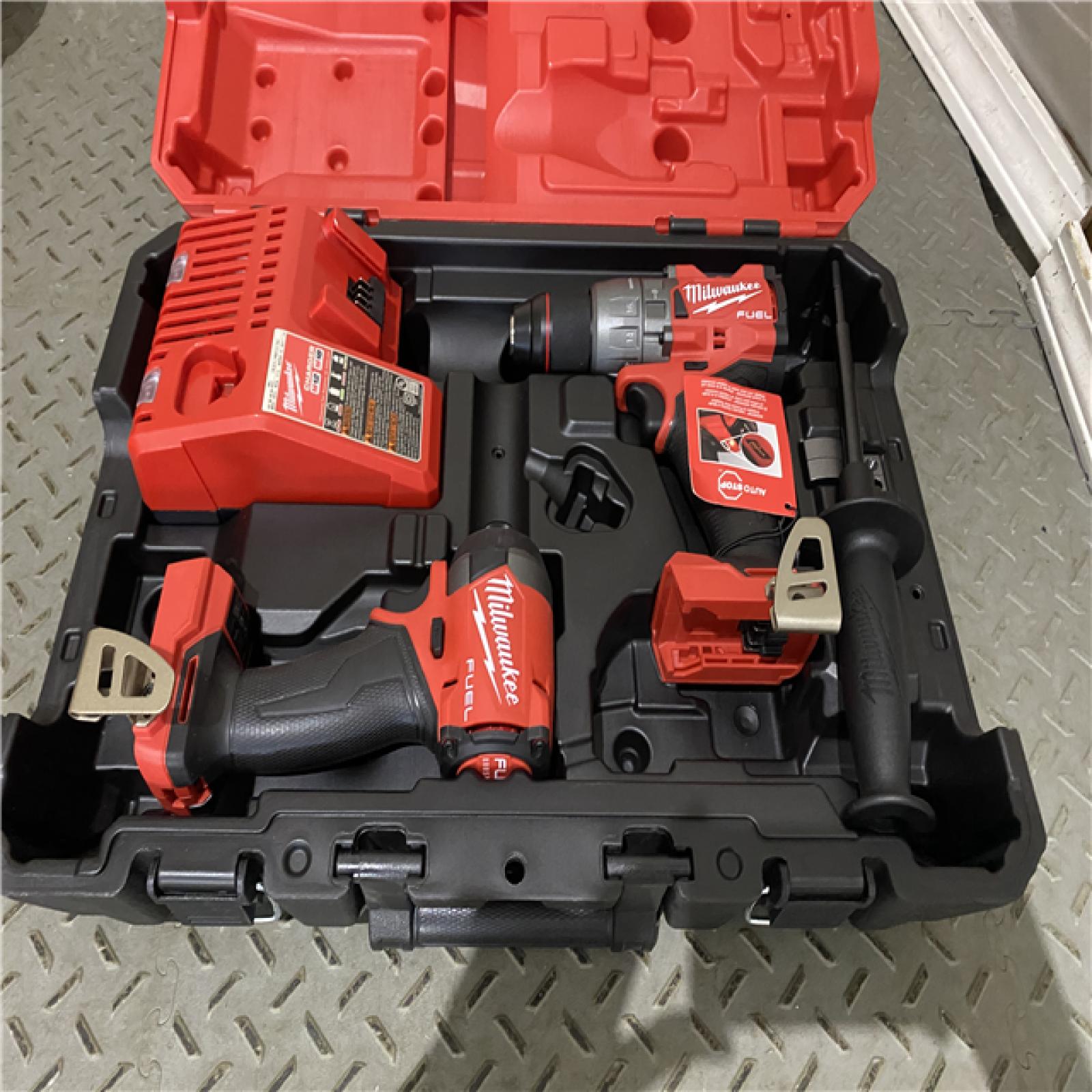 Houston location AS-IS Milwaukee 3697-22 M18 FUEL 1/2 Hammer Driller/Driver &1/4 Hex Impact Driver 2 Tool Combo  MISSING BATTERYS