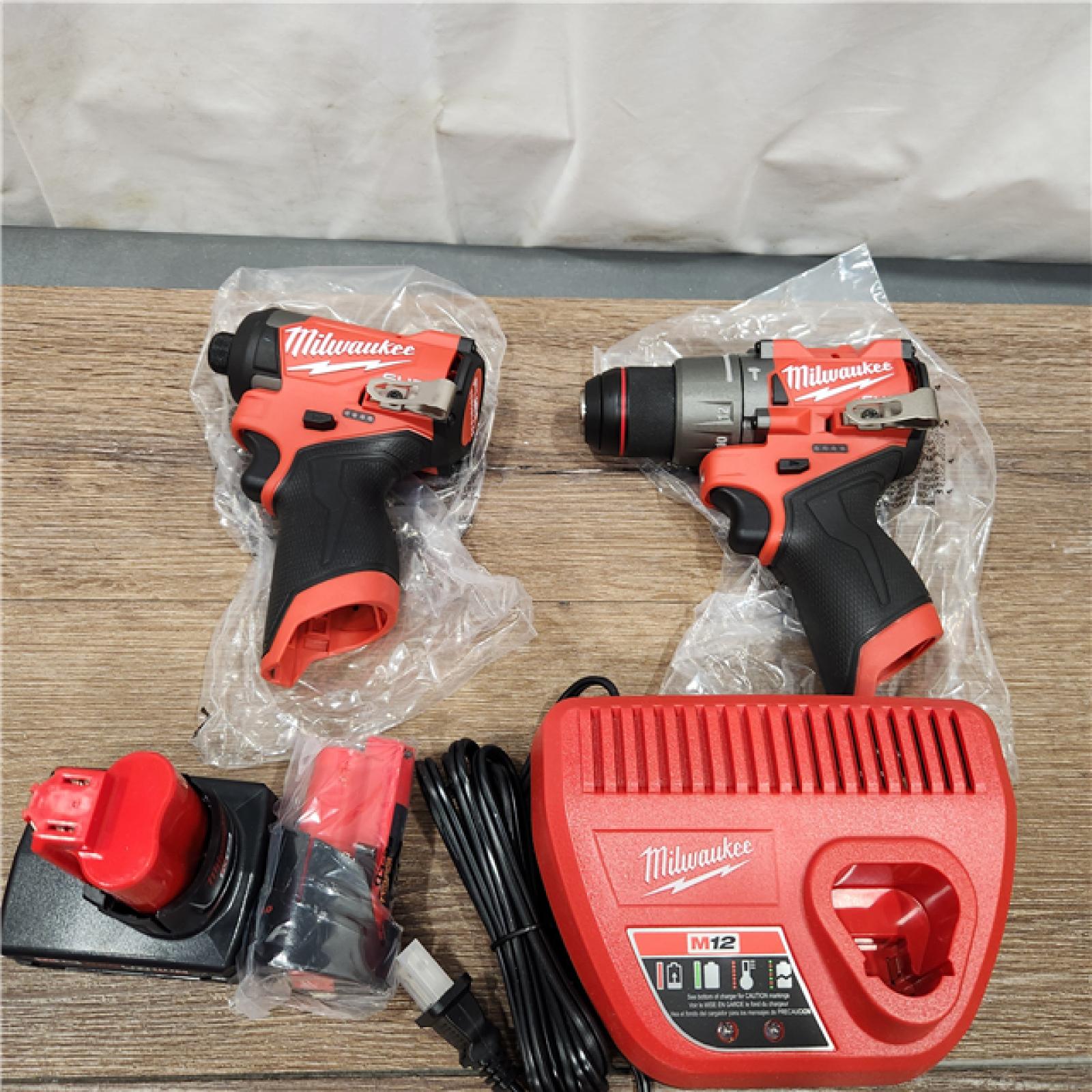 AS-IS Milwaukee 3497-22 12V Brushless Hammer Drill and Impact Driver Combo Kit