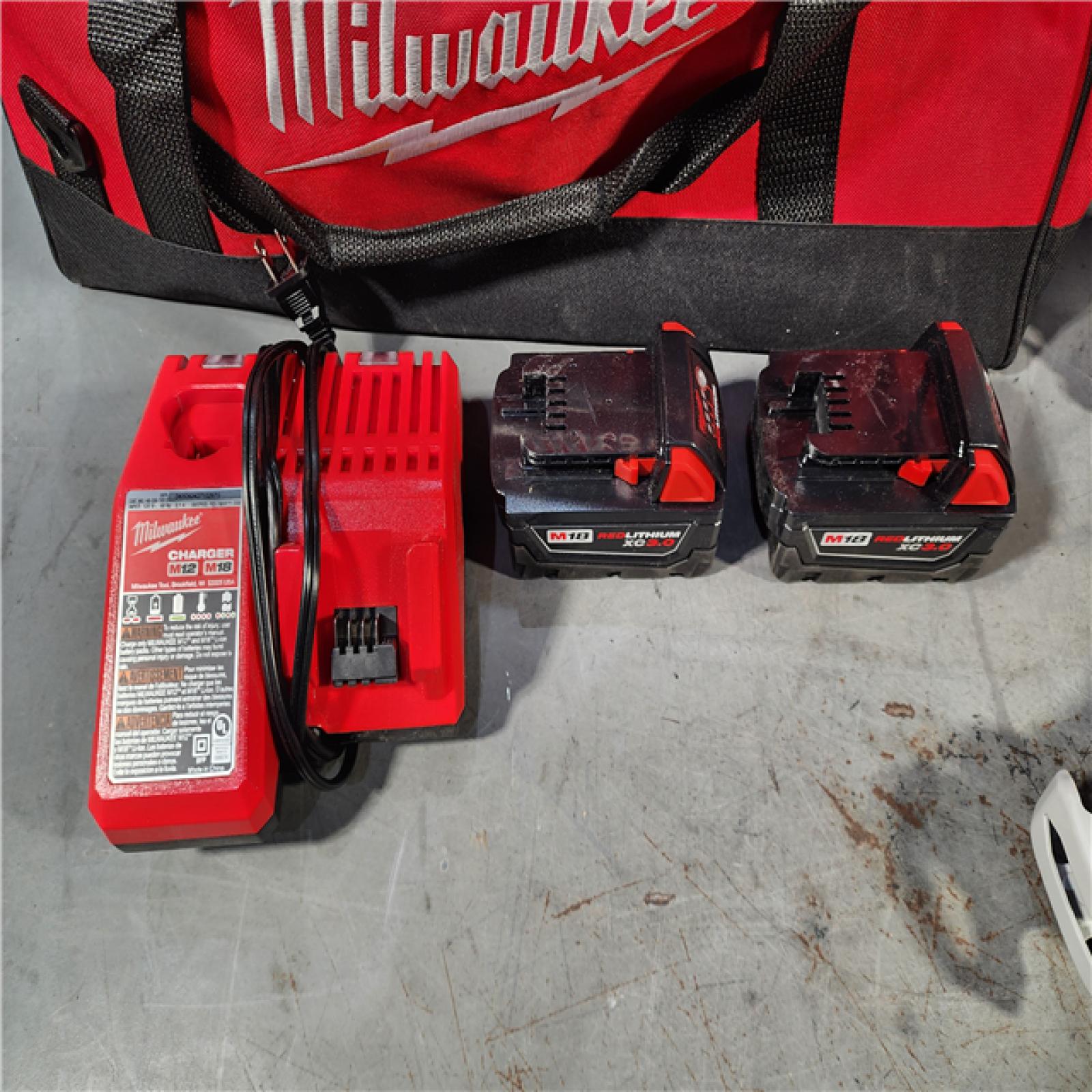 HOUSTON LOCATION - AS-IS MILWAUKEE 7 TOOL COMBO KIT W/ (2) 3.0 AH BATTERY, TOOL BAG & CHARGER