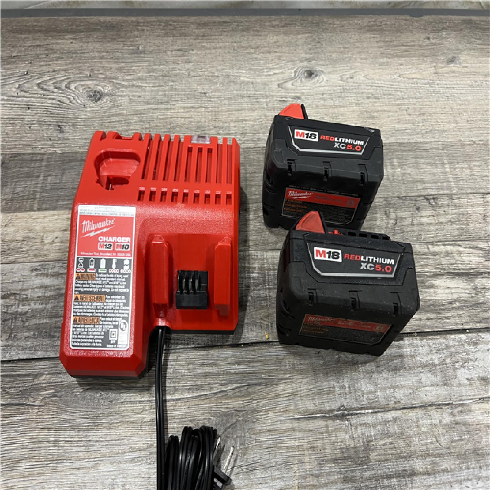 AS-IS Milwaukee M18 18-Volt Lithium-Ion XC Starter Kit with Two 5.0Ah Batteries / Charger (48-59-1852B)