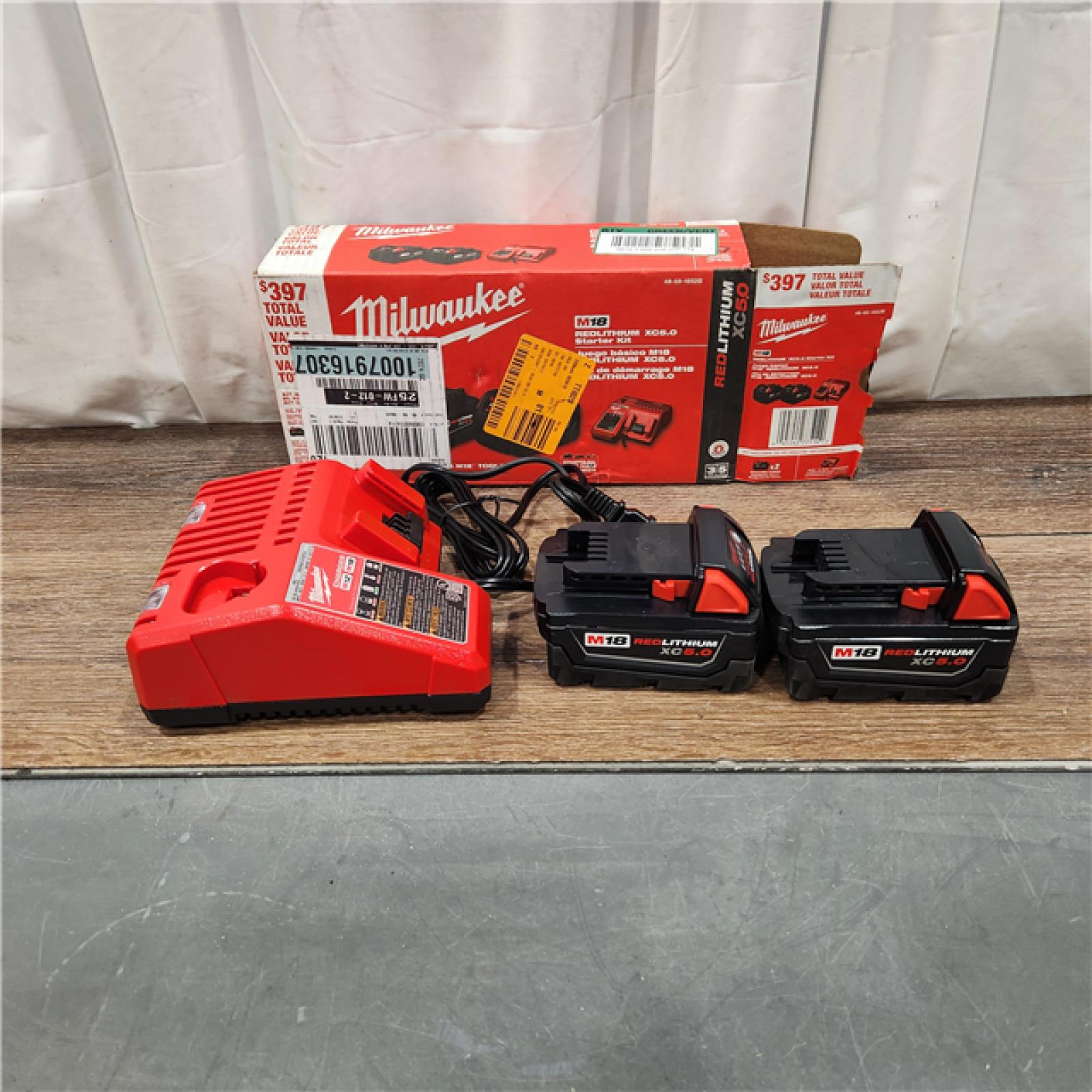 AS IS M18 18-Volt Lithium-Ion XC Starter Kit with Two 5.0Ah Batteries and Charger