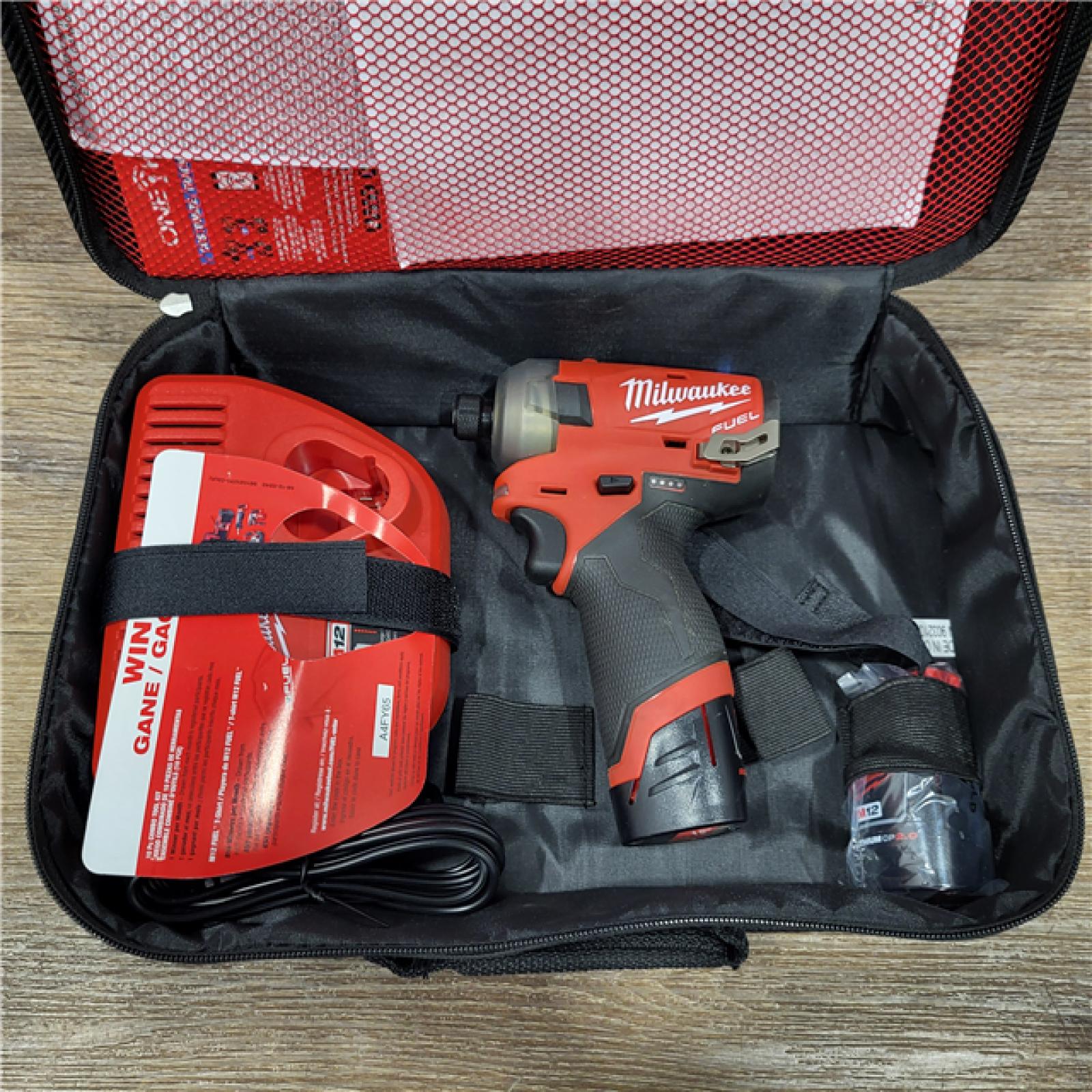 AS-IS M12 FUEL SURGE 12V Lithium-Ion Brushless Cordless 1/4 in. Hex Impact Driver Compact Kit W/Two 2.0Ah Batteries, Bag