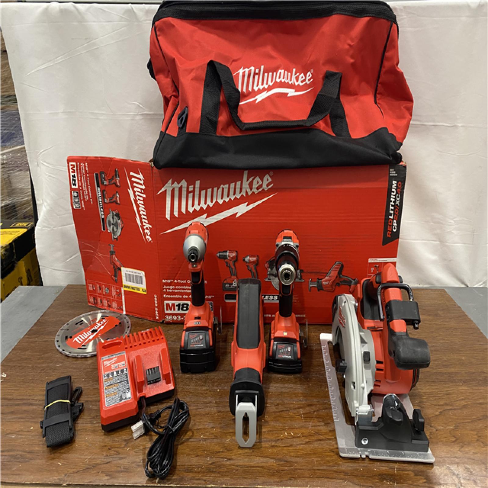 AS-IS Milwaukee M18 18-Volt Lithium-Ion Brushless Cordless Combo Kit (4-Tool) with 2-Batteries, 1-Charger and Tool Bag