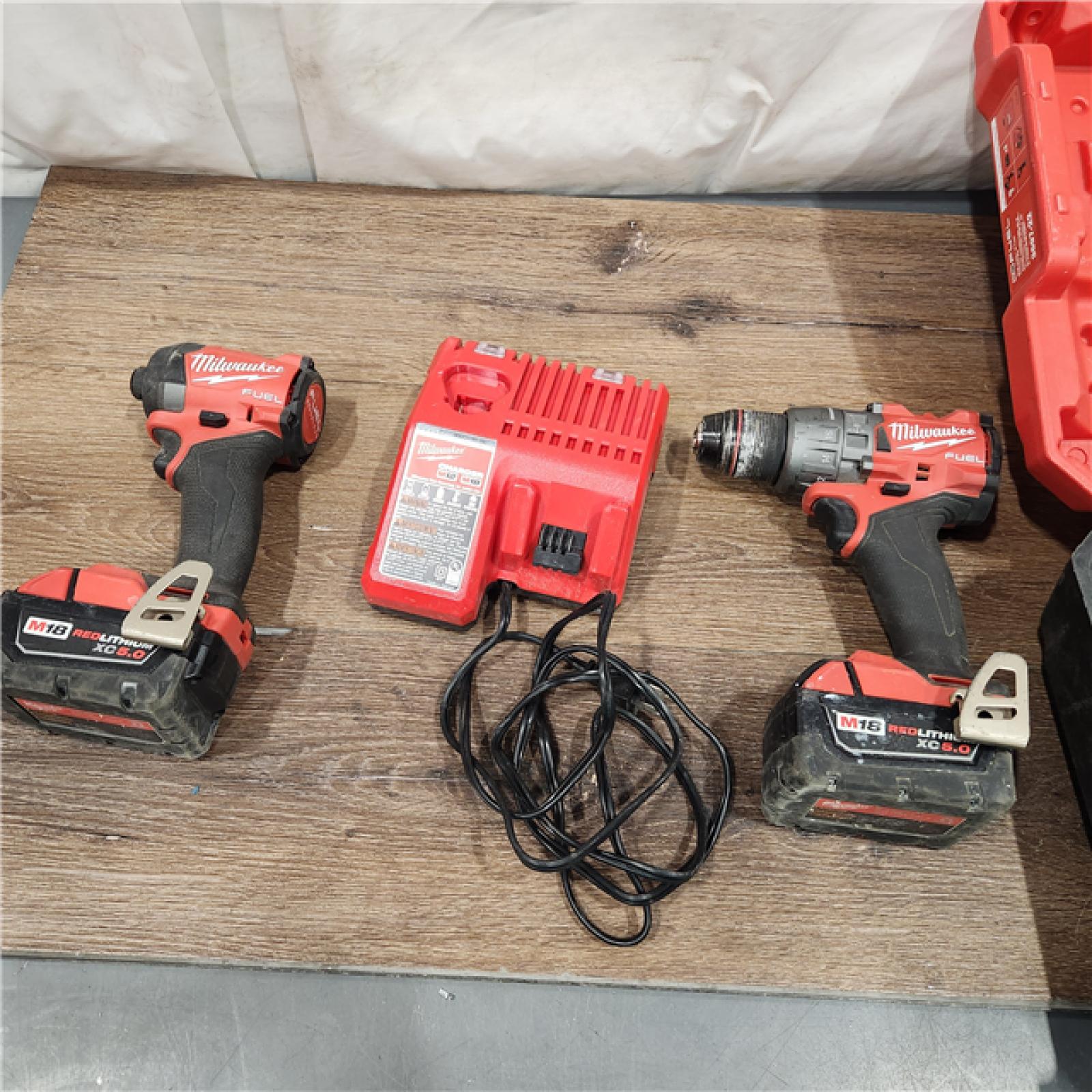 AS-IS Milwaukee M18 FUEL 18V Lithium-Ion Brushless Cordless Hammer Drill and Impact Driver Combo Kit (2-Tool) with 2 Batteries