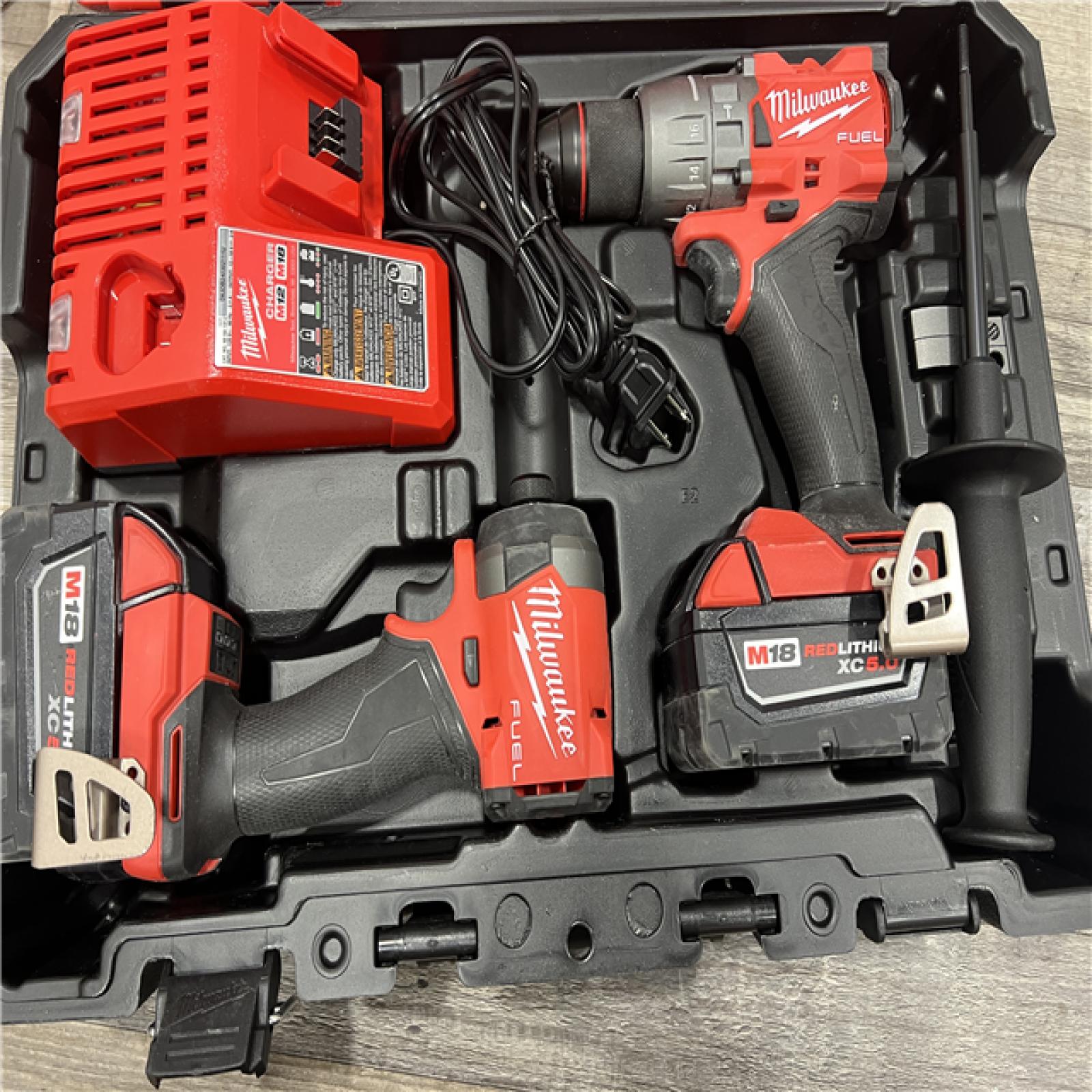 AS-IS MILWAUKEE M18 FUEL 18V Lithium-Ion Brushless Cordless Hammer Drill and Impact Driver Combo Kit (2-Tool) with 2 Batteries