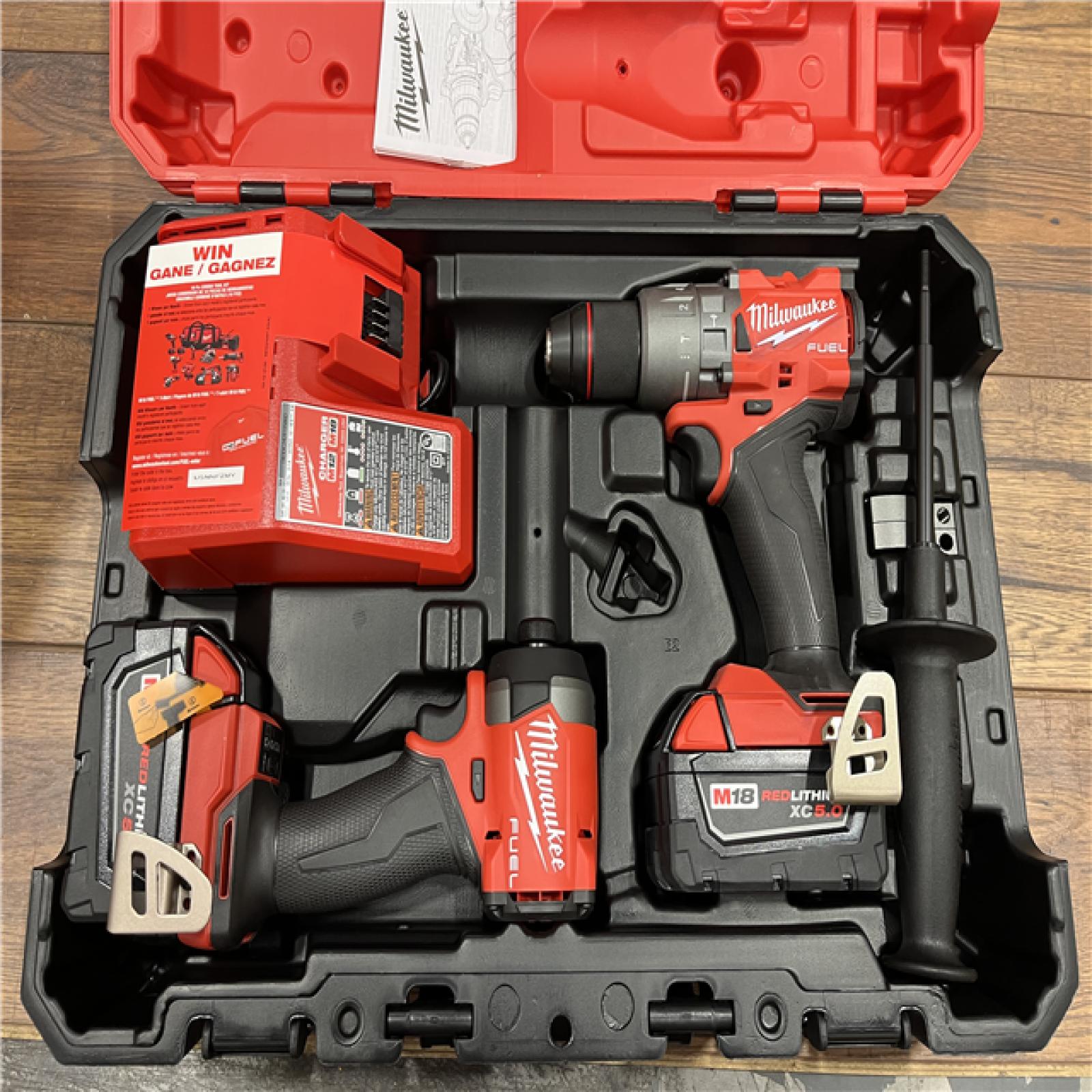 AS-IS Milwaukee M18 FUEL 18V Lithium-Ion Brushless Cordless Hammer Drill and Impact Driver Combo Kit (2-Tool) with 2 Batteries