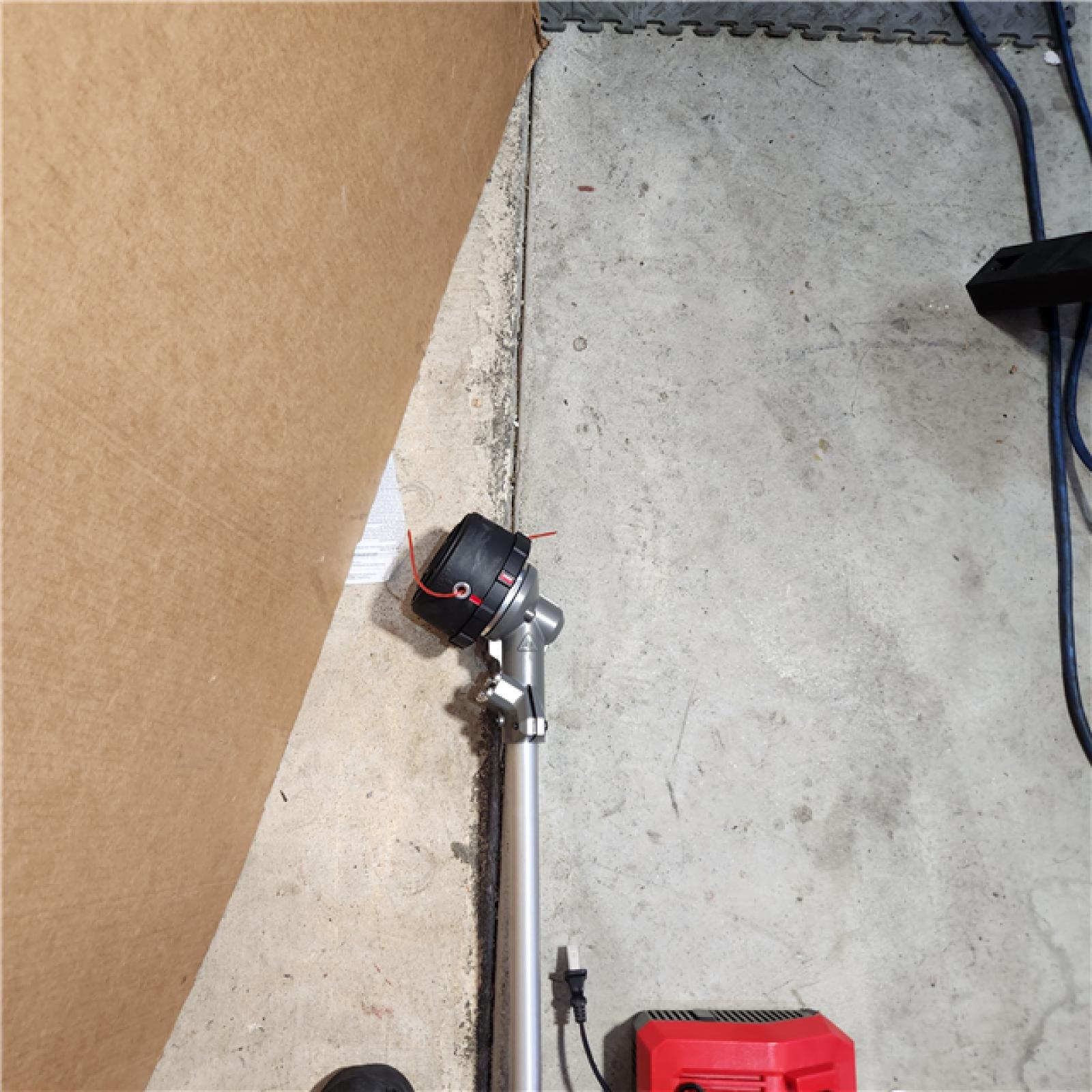 Houston location AS-IS MILWAUKEE M18 FUEL 18V Brushless Cordless 17 in. Dual Battery Straight Shaft String Trimmer with (2) 8.0 Ah Batteries and Charger