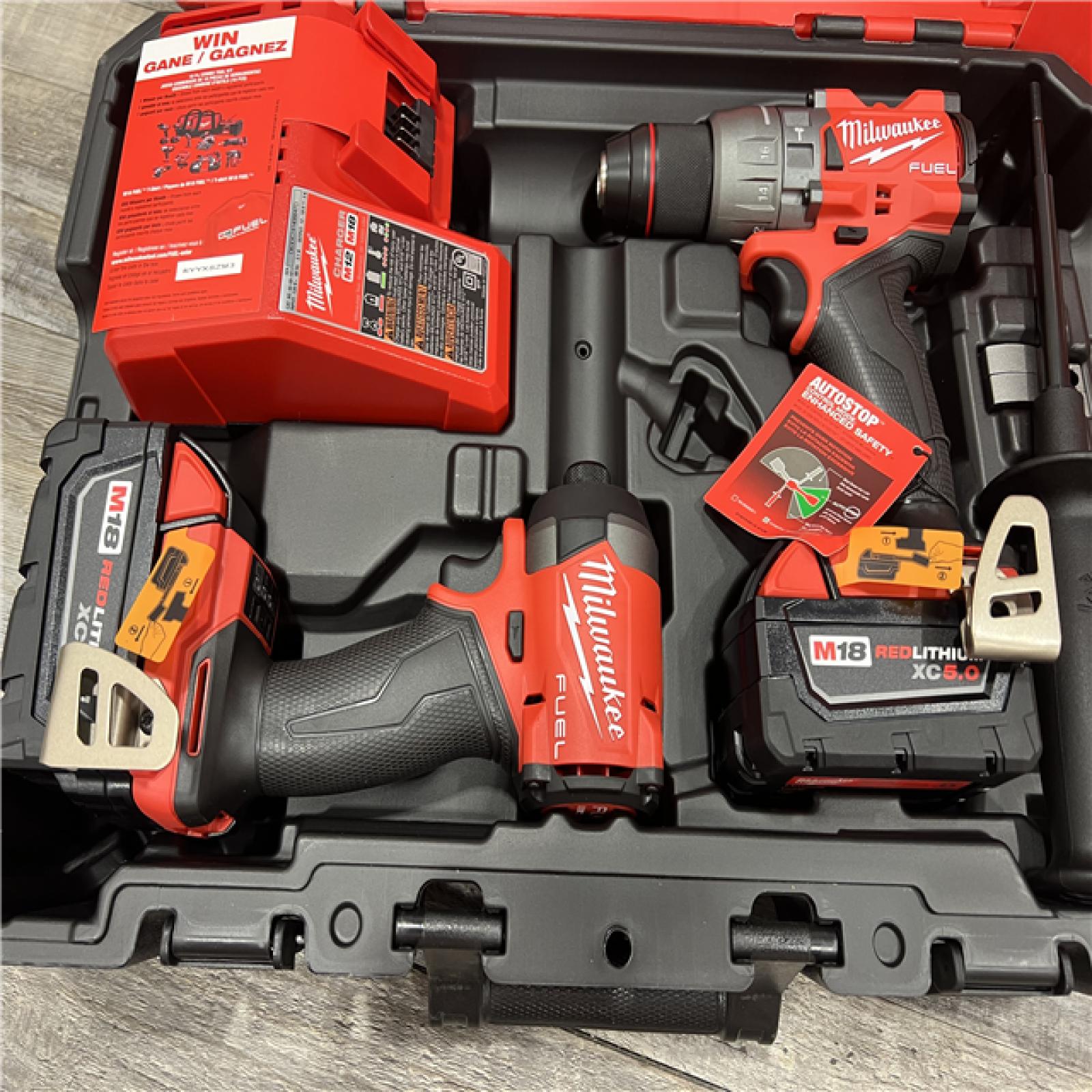 AS-IS MILWAUKEE M18 FUEL 18V Lithium-Ion Brushless Cordless Hammer Drill and Impact Driver Combo Kit (2-Tool) with 2 Batteries