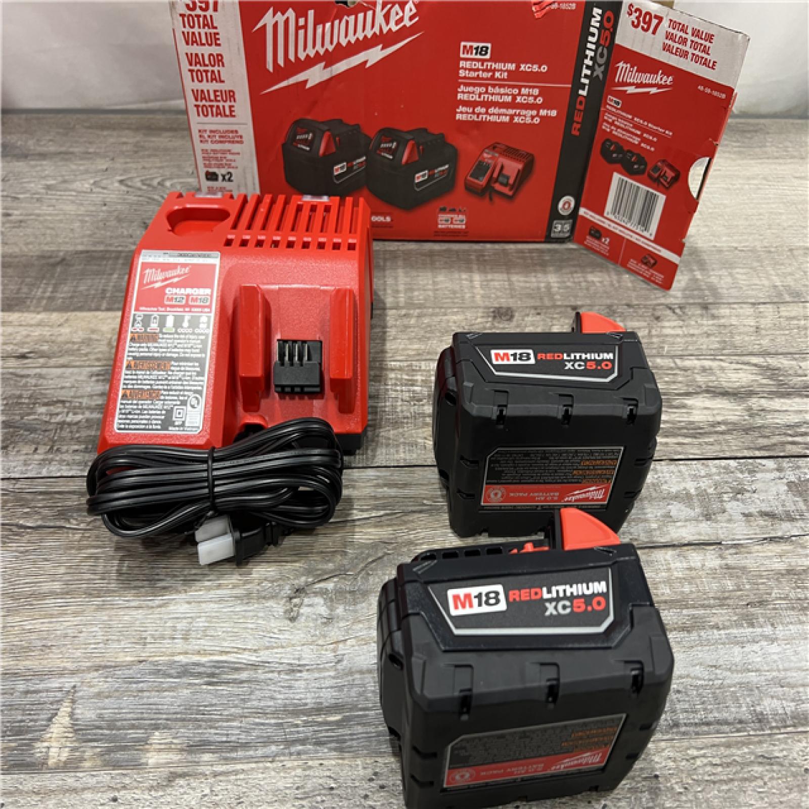 AS-IS Milwaukee M18 18-Volt Lithium-Ion XC Starter Kit with Two 5.0Ah Batteries / Charger (48-59-1852B)