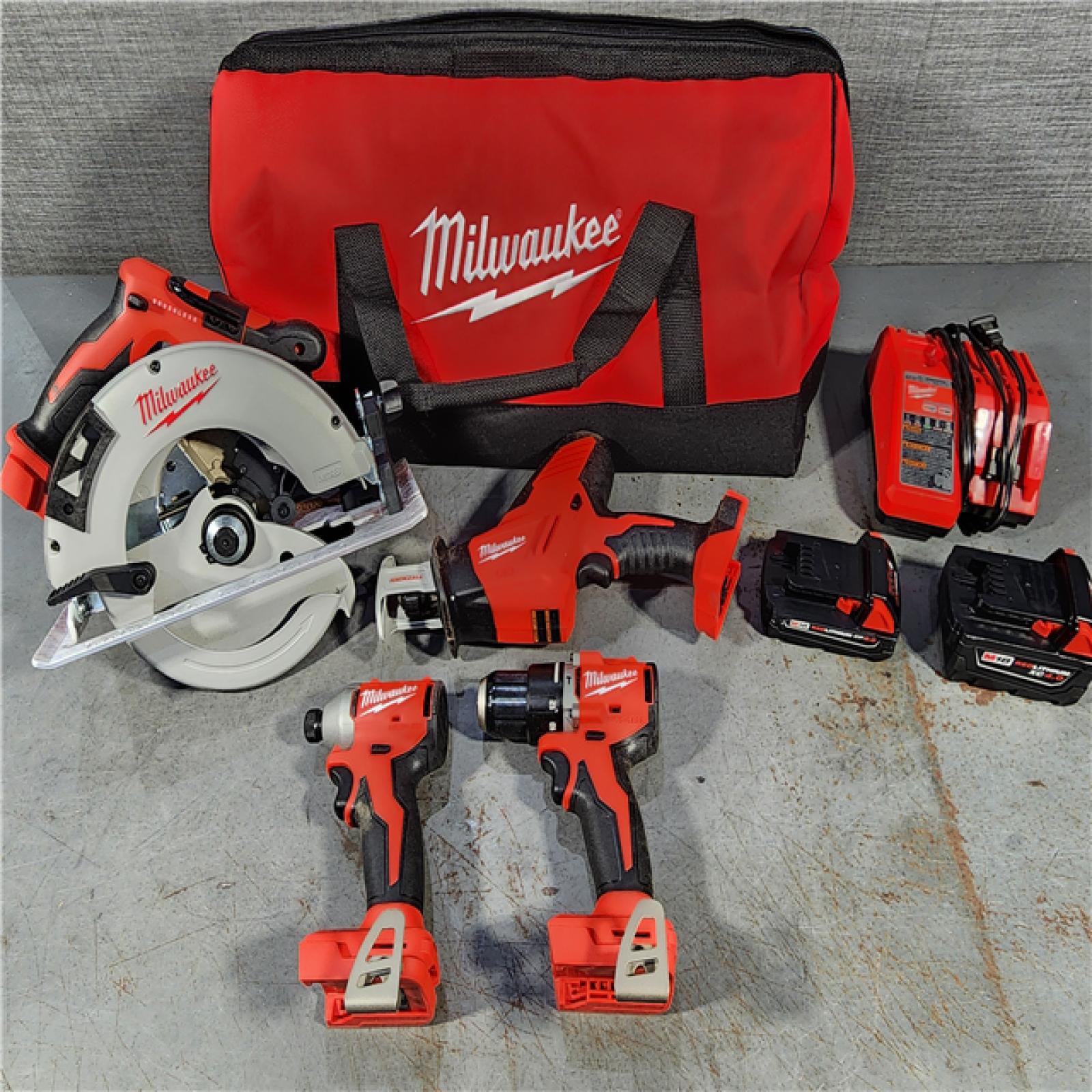 HOUSTON LOCATION - AS-IS Milwaukee M18 18-Volt Lithium-Ion Brushless Cordless Combo Kit (4-Tool) with 2-Batteries, 1-Charger and Tool Bag