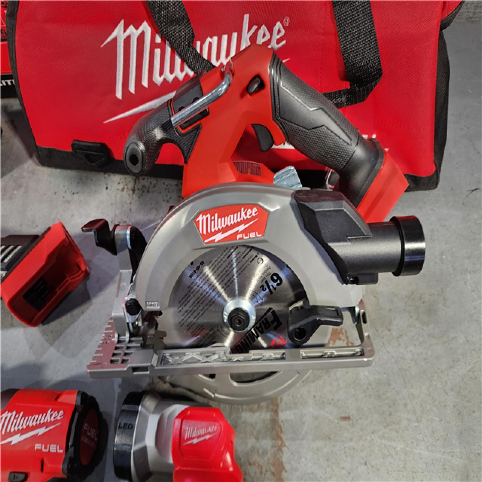 HOUSTON LOCATION - AS-IS (APPEARS LIKE NEW) M18 18-Volt Lithium-Ion Brushless Cordless FUEL Combo Kit (5-Tool) with 2-Batteries, 1-Charger, and Tool Bag