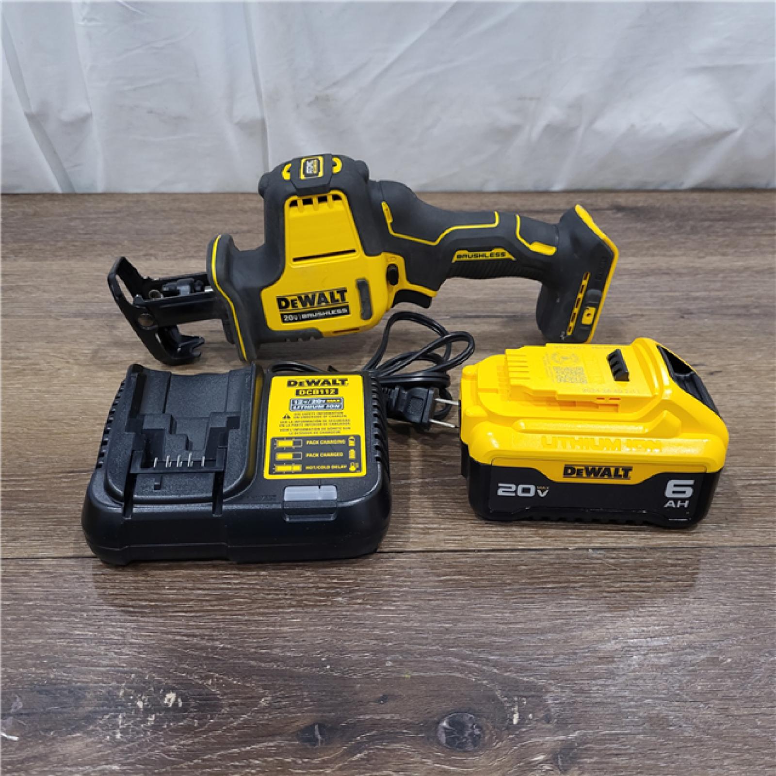 AS-IS ATOMIC 20V MAX Cordless Brushless Compact Reciprocating Saw, (1) 5.0Ah Battery, Charger, and Bag