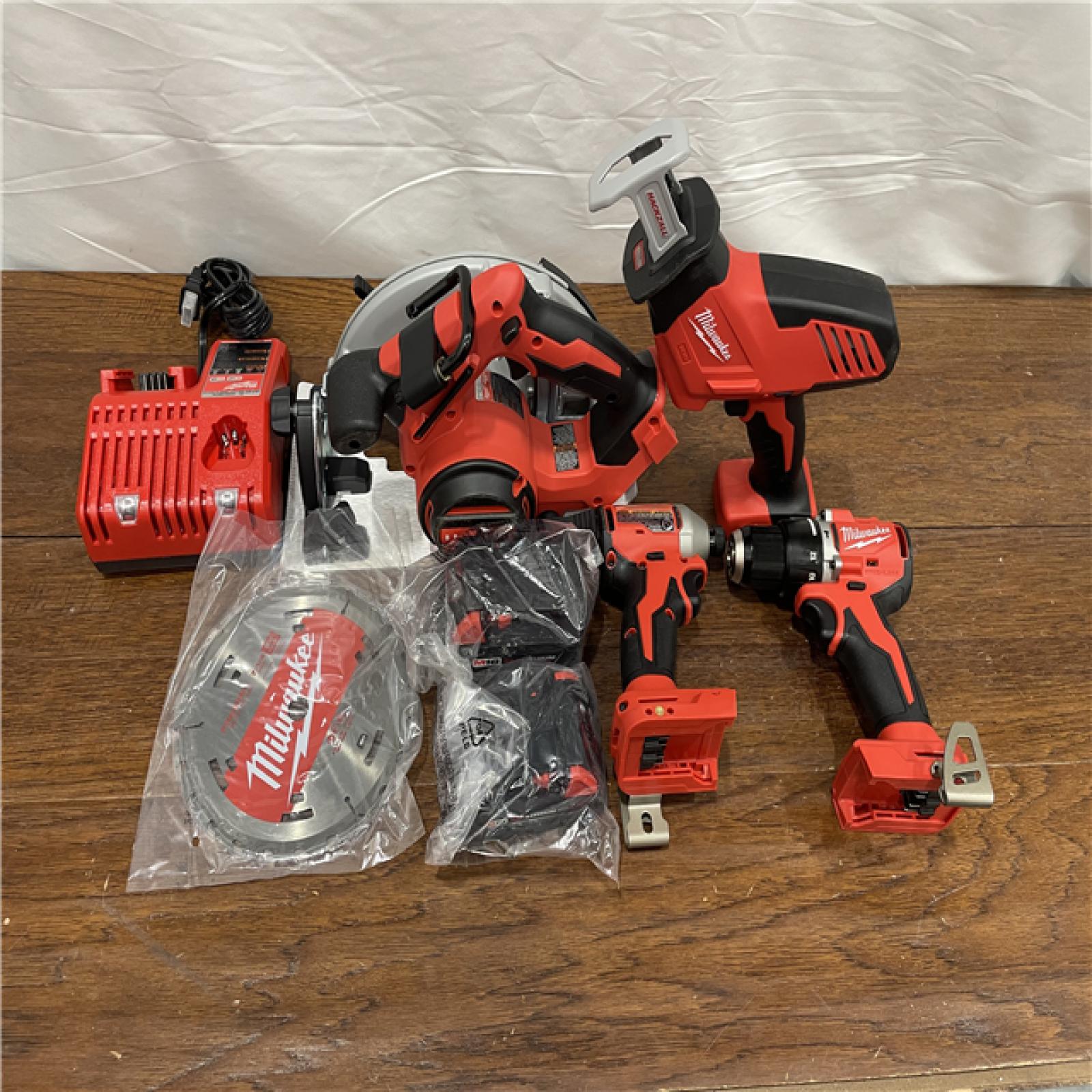 AS-IS M18 18-Volt Lithium-Ion Brushless Cordless Combo Kit (4-Tool) with 2-Batteries, 1-Charger and Tool Bag