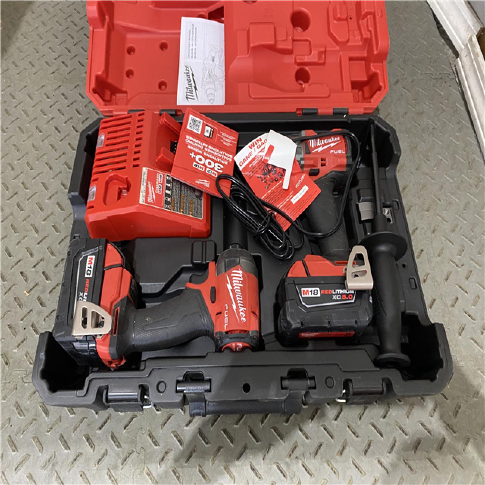 Houston location AS-IS Milwaukee 3697-22 M18 FUEL 1/2 Hammer Driller/Driver &1/4 Hex Impact Driver 2 Tool Combo Kit