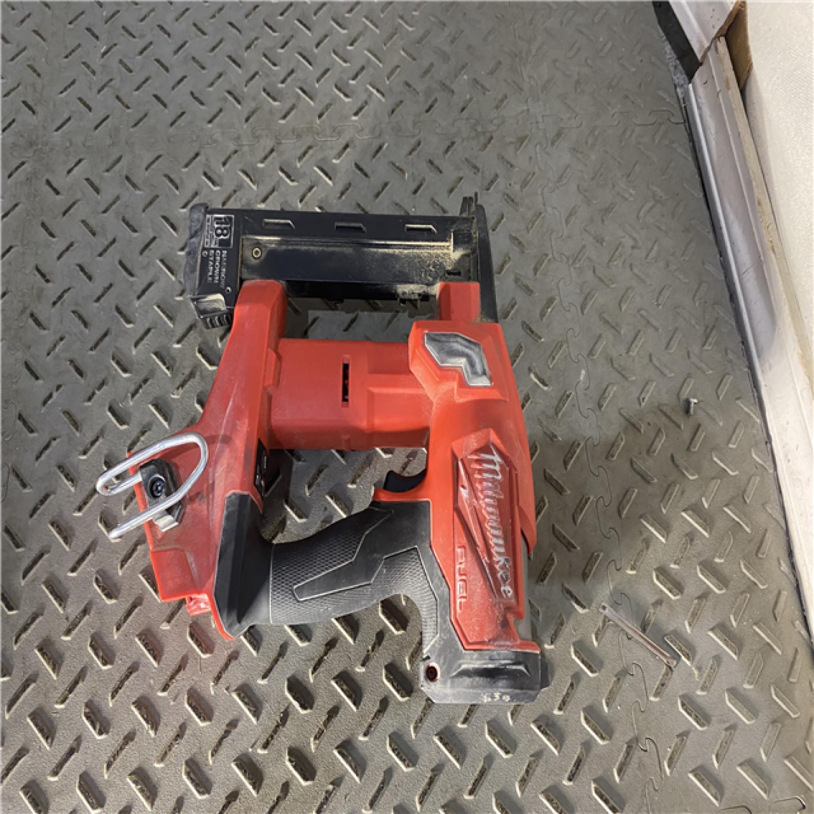 Houston location AS-IS MILWAUKEE M18 FUEL 18-Volt Lithium-Ion Brushless Cordless 18-Gauge 1/4 in. Narrow Crown Stapler (Tool-Only)