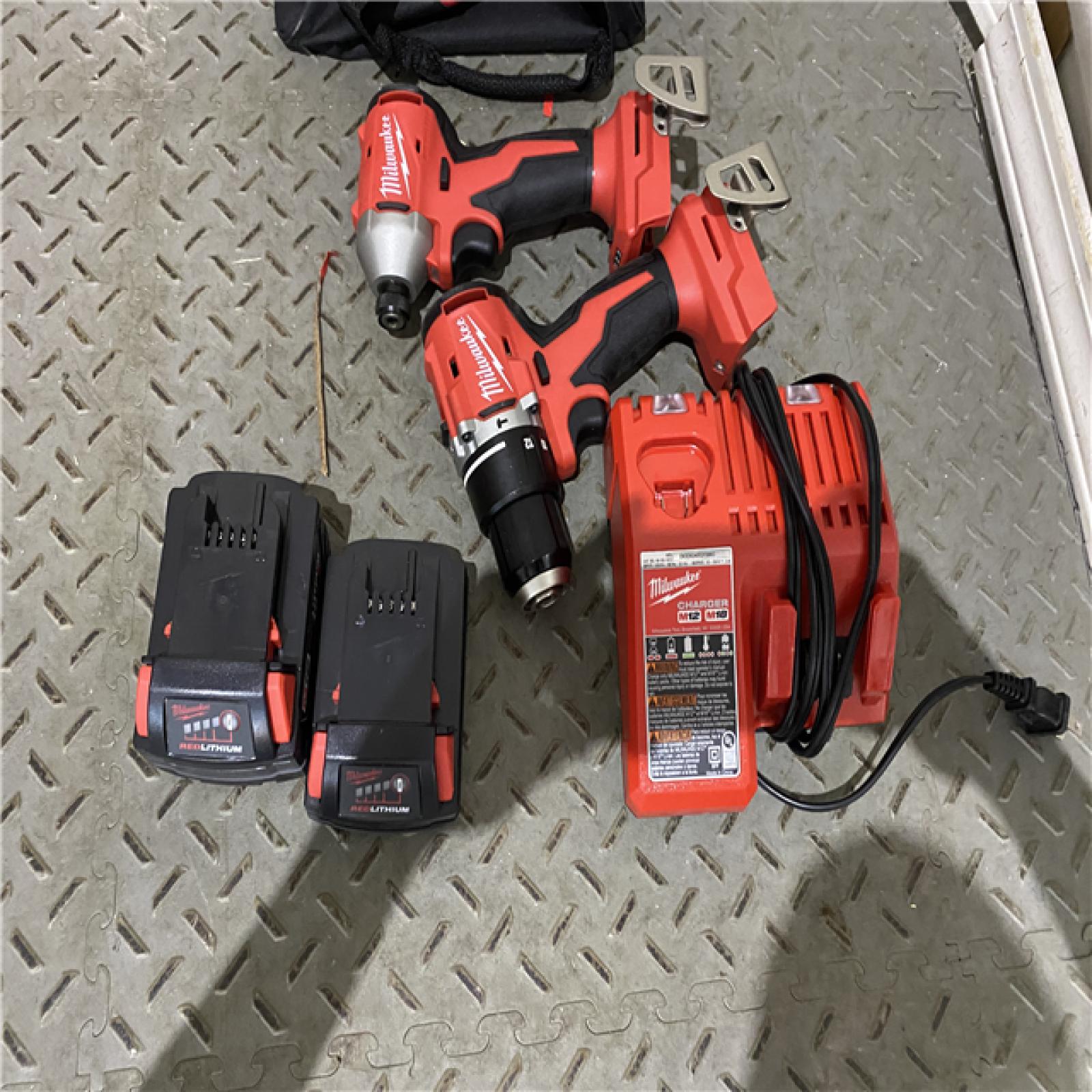 Houston location AS-IS MILWAUKEE M18 18-Volt Lithium-Ion Brushless Cordless Compact Hammer Drill/Impact Combo Kit (2-Tool) with (2) Batteries, Bag