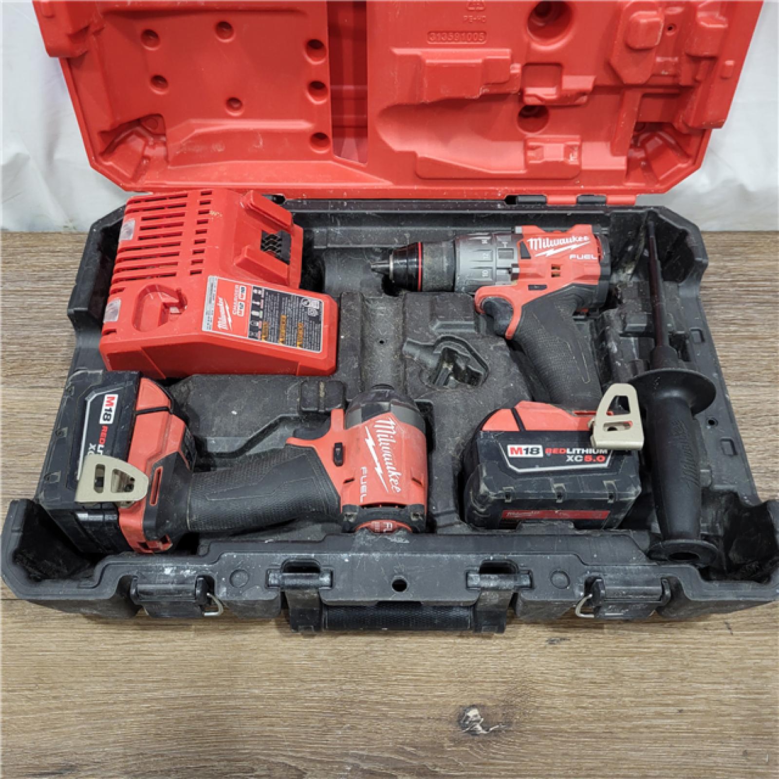 AS-IS M18 FUEL 18V Lithium-Ion Brushless Cordless Hammer Drill and Impact Driver Combo Kit (2-Tool) with 2 Batteries