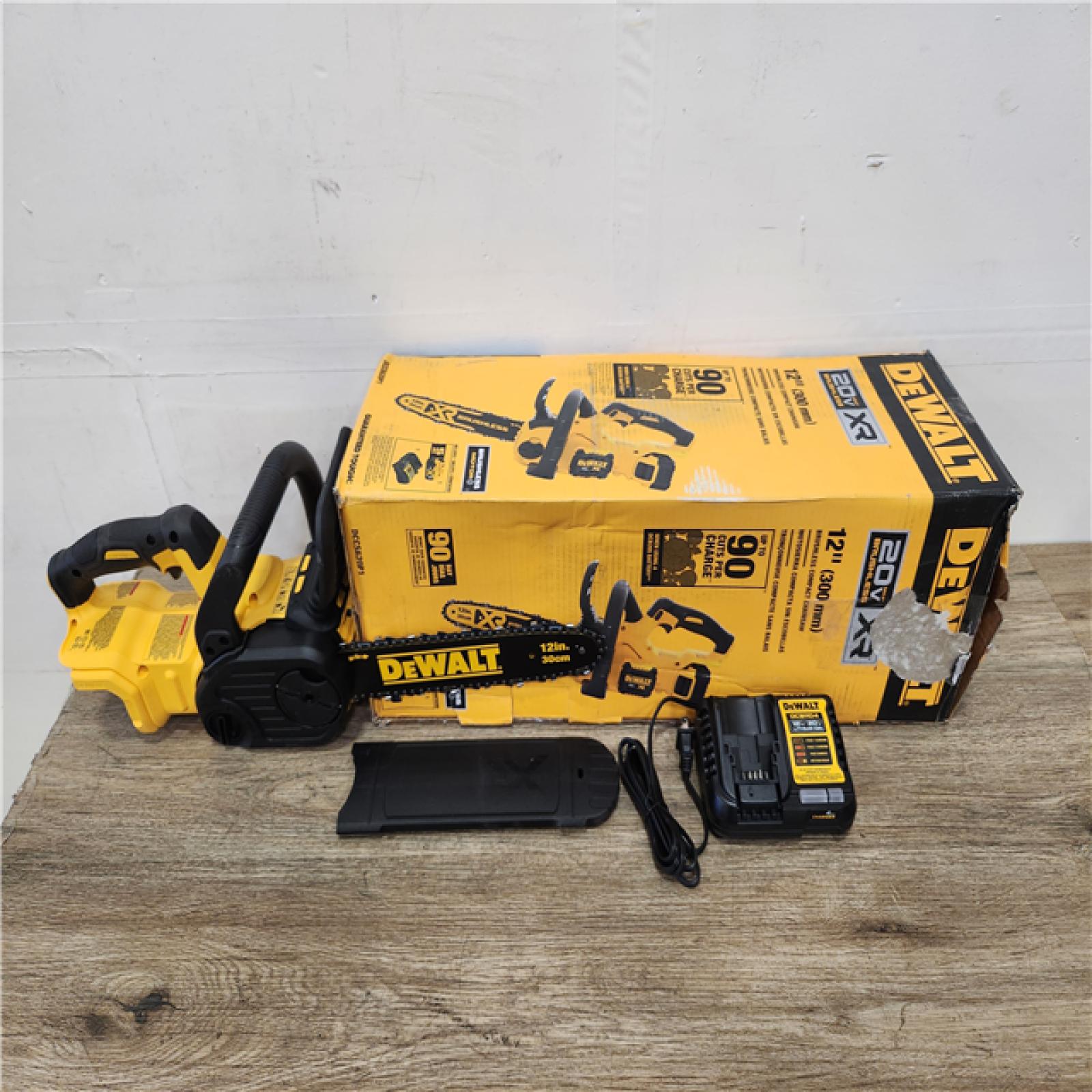 Phoenix Location NEW DEWALT 20V MAX 12in. Brushless Cordless Battery Powered Chainsaw Kit with Charger (No Battery)