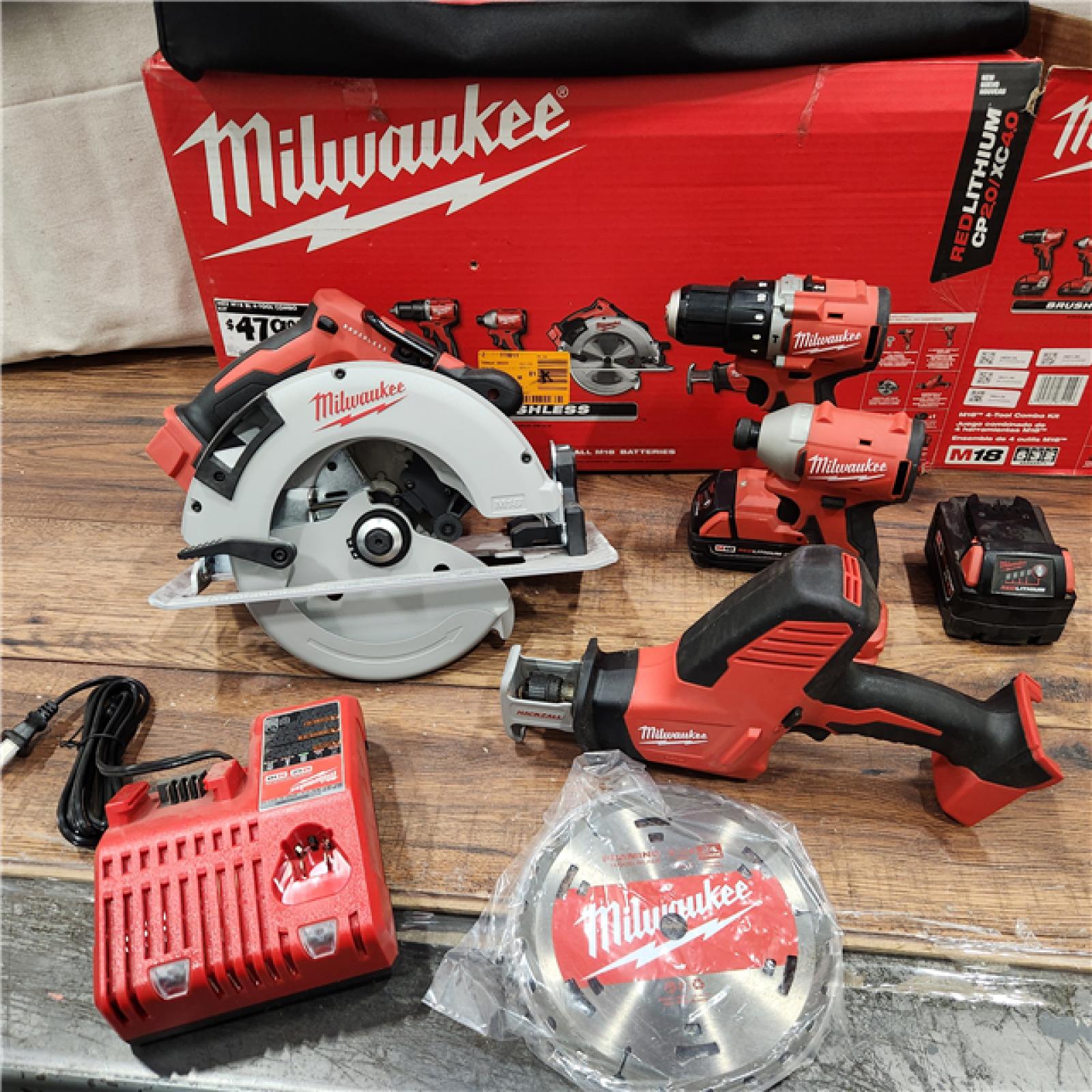 AS-IS Milwaukee M18 18-Volt Lithium-Ion Brushless Cordless Combo Kit (4-Tool) with 2-Batteries, 1-Charger and Tool Bag