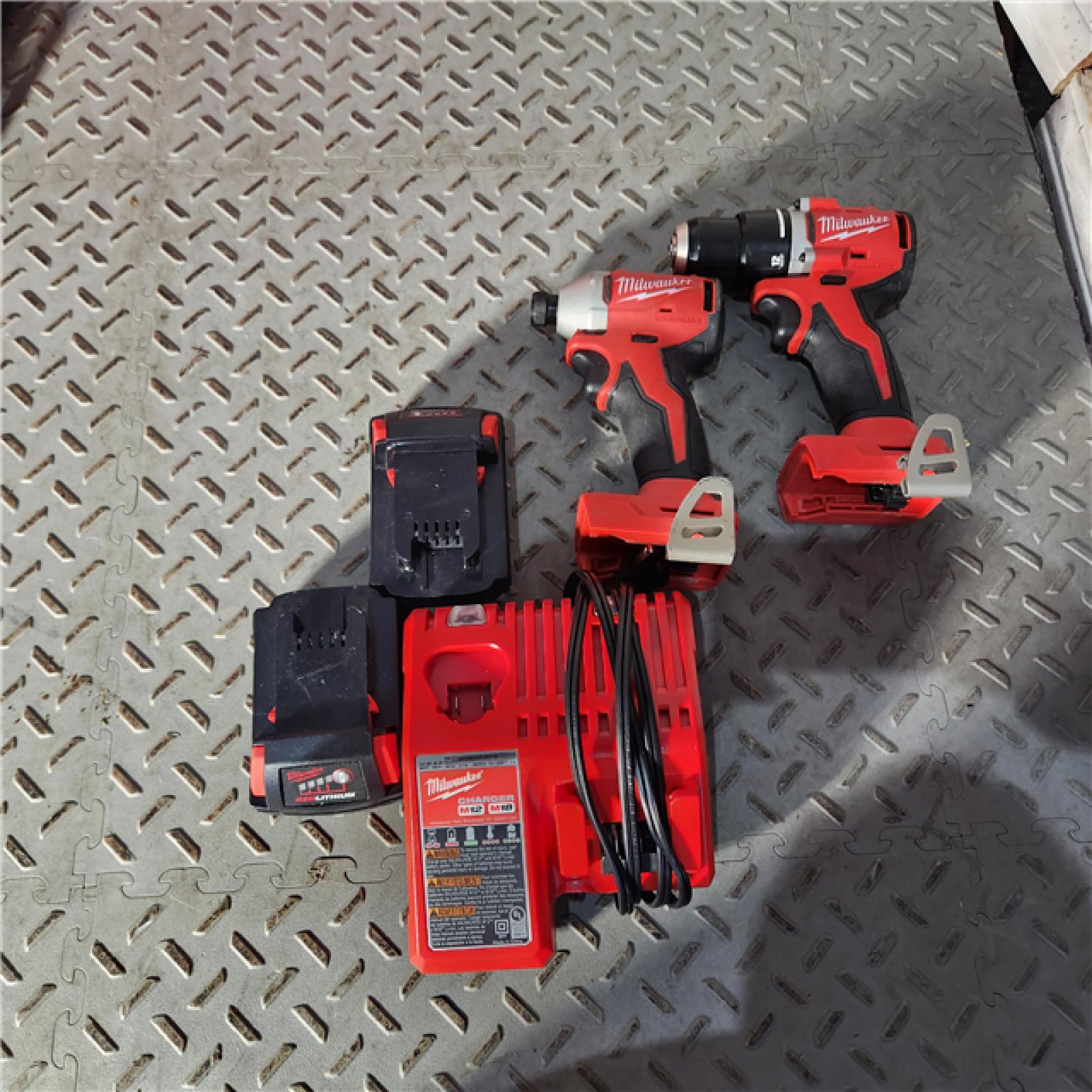 Houston location AS-IS MILWAUKEE M18 18V Lithium-Ion Brushless Cordless Compact Drill/Impact Combo Kit (2-Tool) W/(2) 2.0 Ah Batteries, Charger & Bag