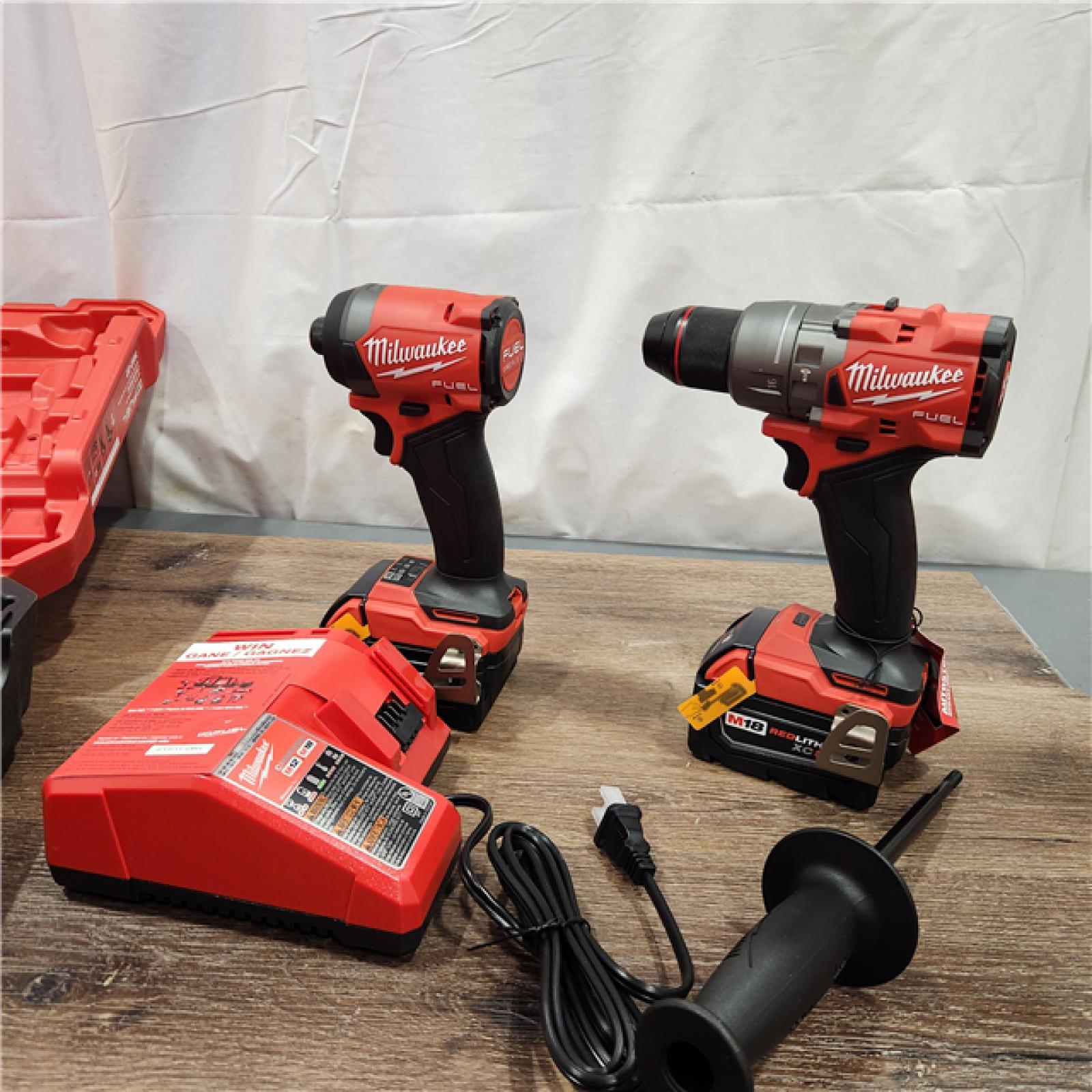 AS-IS Milwaukee M18 FUEL 18V Lithium-Ion Brushless Cordless Hammer Drill and Impact Driver Combo Kit (2-Tool) with 2 Batteries