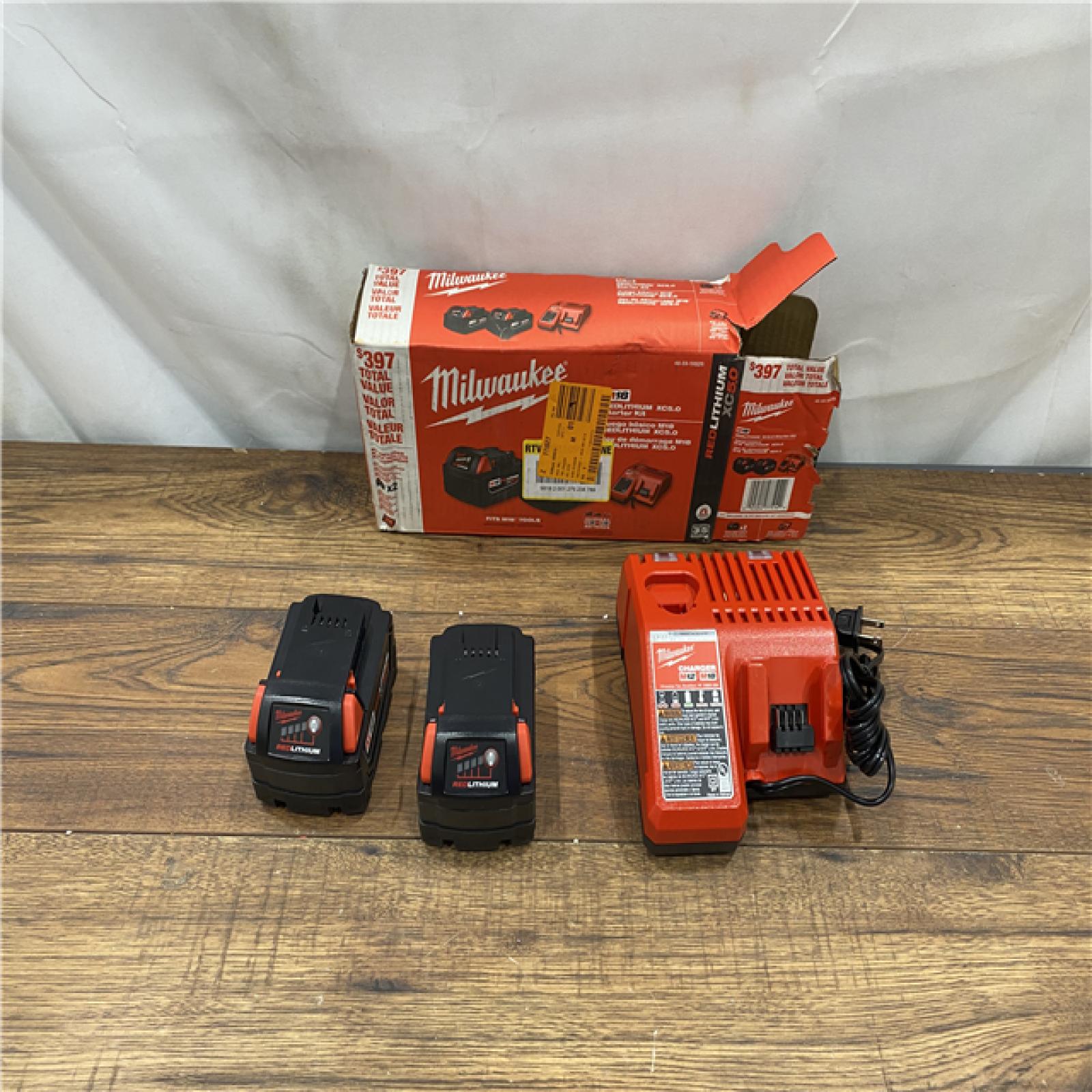 AS IS M18 18-Volt Lithium-Ion XC Starter Kit with Two 5.0Ah Batteries and Charger