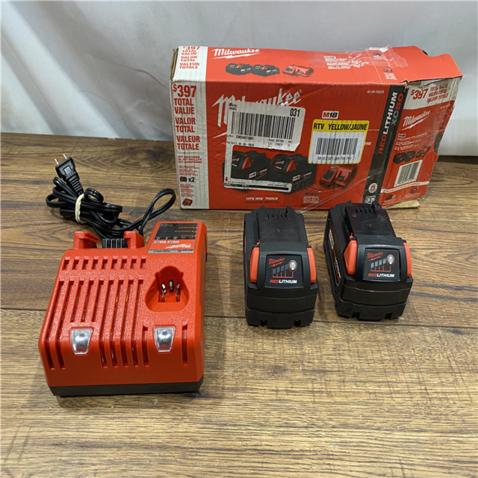 AS IS Milwaukee M18 18-Volt Lithium-Ion XC Starter Kit with Two 5.0Ah Batteries / Charger (48-59-1852B)