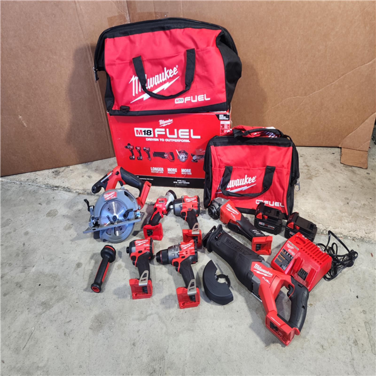 HOUSTON LOCATION - AS-IS (APPEARS LIKE NEW) Milwaukee M18 FUEL 18V Lithium-Ion Brushless Cordless Combo Kit with Two 5.0 Ah Batteries  1 Charger  2 Tool Bags (7-Tool)