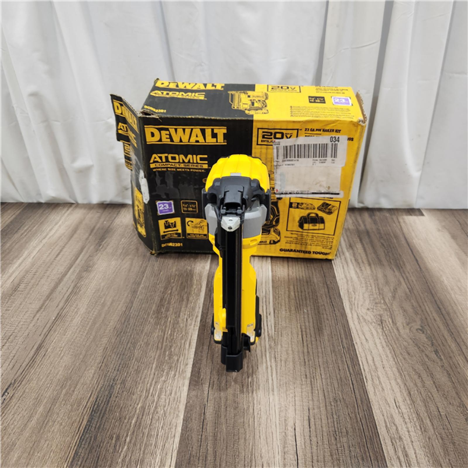 AS IS DEWALT ATOMIC 20V MAX Lithium Ion Cordless 23 Gauge Pin Nailer Kit with 3.0Ah Battery and Charger