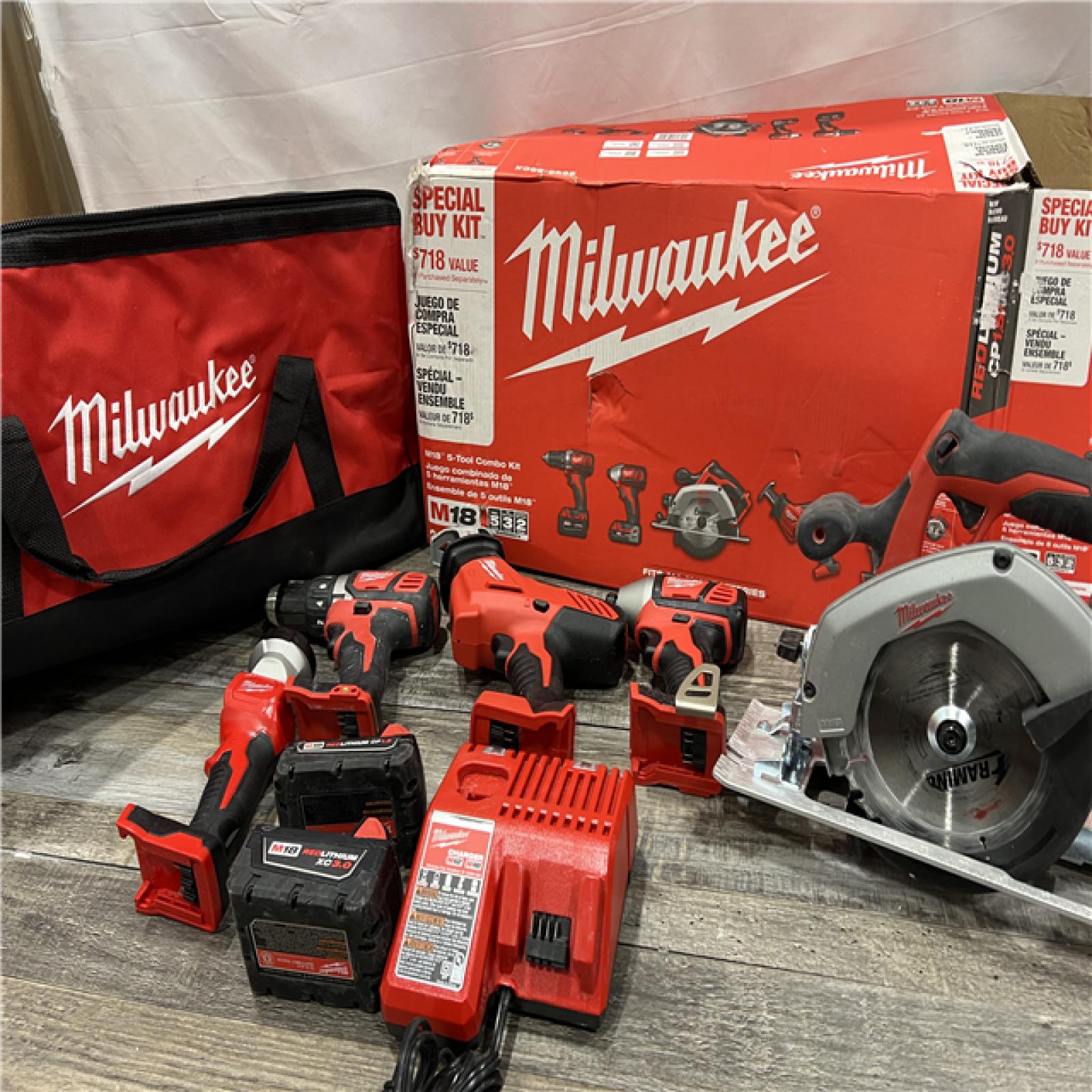 AS-IS Milwaukee M18 18-Volt Lithium-Ion Cordless Combo Tool Kit (5-Tool) with (1) 3.0Ah and (1) 1.5Ah Battery, (1) Charger, (1) Tool Bag