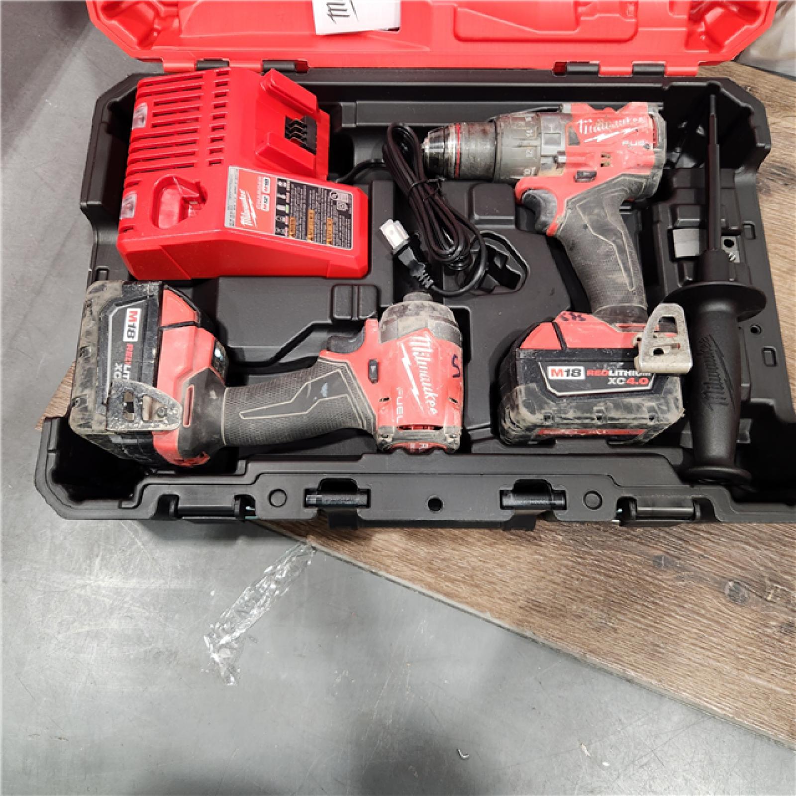 AS-IS Milwaukee M18 FUEL 18V Lithium-Ion Brushless Cordless Hammer Drill and Impact Driver Combo Kit (2-Tool) with 2 Batteries