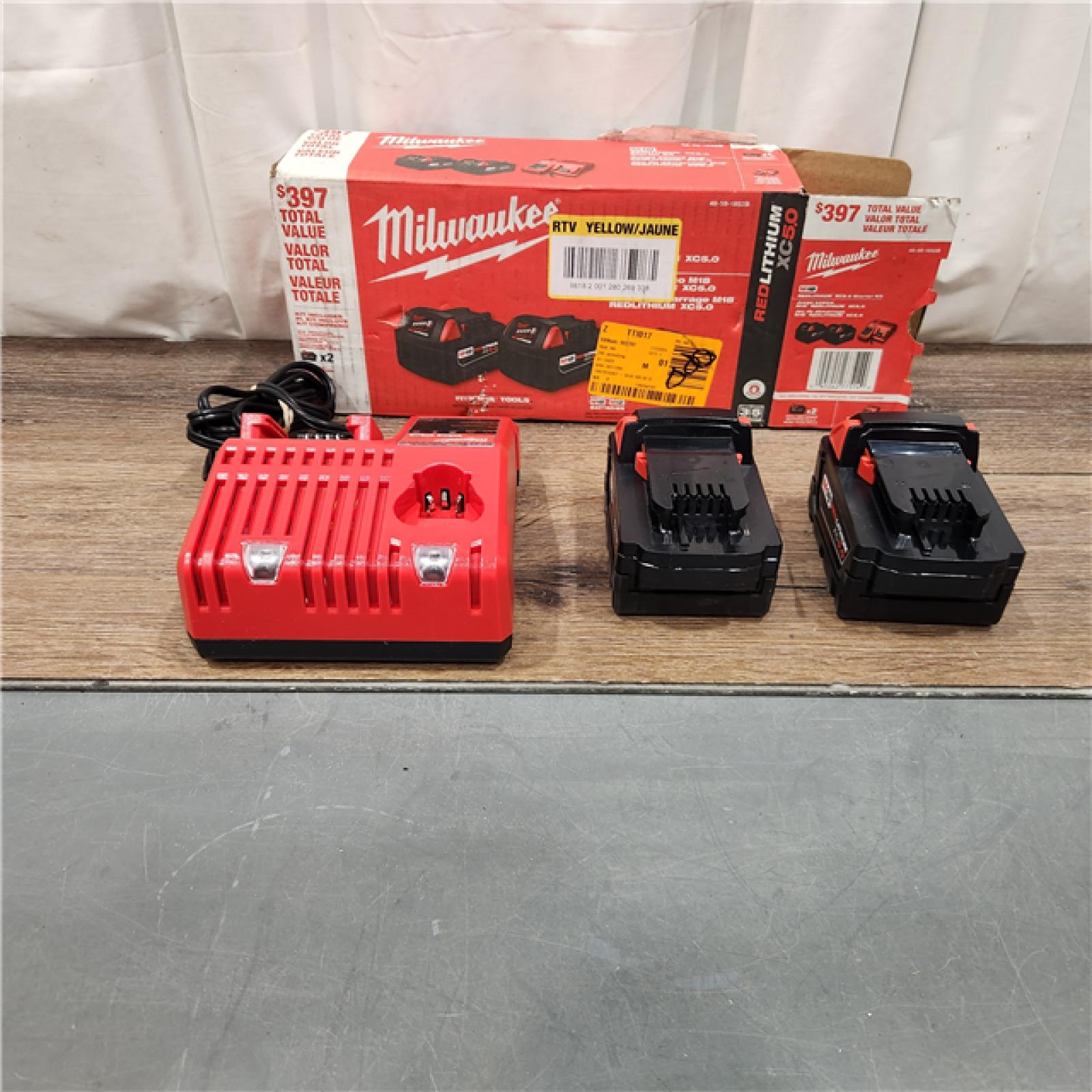 AS IS M18 18-Volt Lithium-Ion XC Starter Kit with Two 5.0Ah Batteries and Charger