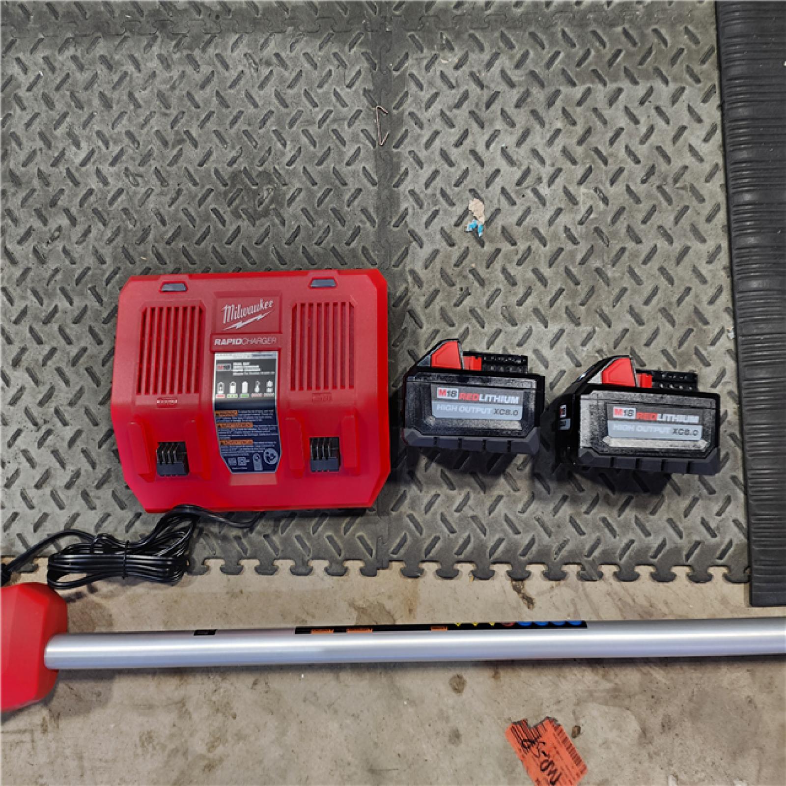 HOUSTON LOCATION - AS-IS (APPEARS LIKE NEW)Milwaukee M18 FUEL 18V Brushless Cordless 17 in. Dual Battery Straight Shaft String Trimmer Kit