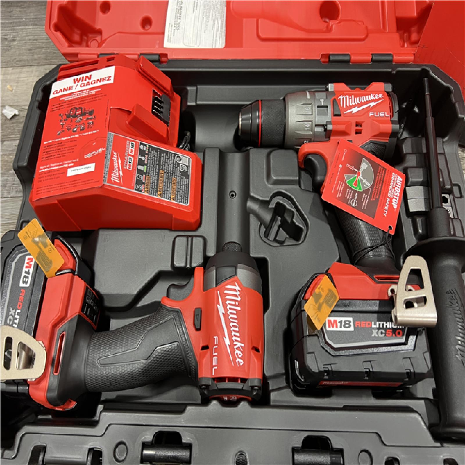 AS-IS MILWAUKEE M18 FUEL 18V Lithium-Ion Brushless Cordless Hammer Drill and Impact Driver Combo Kit (2-Tool) with 2 Batteries