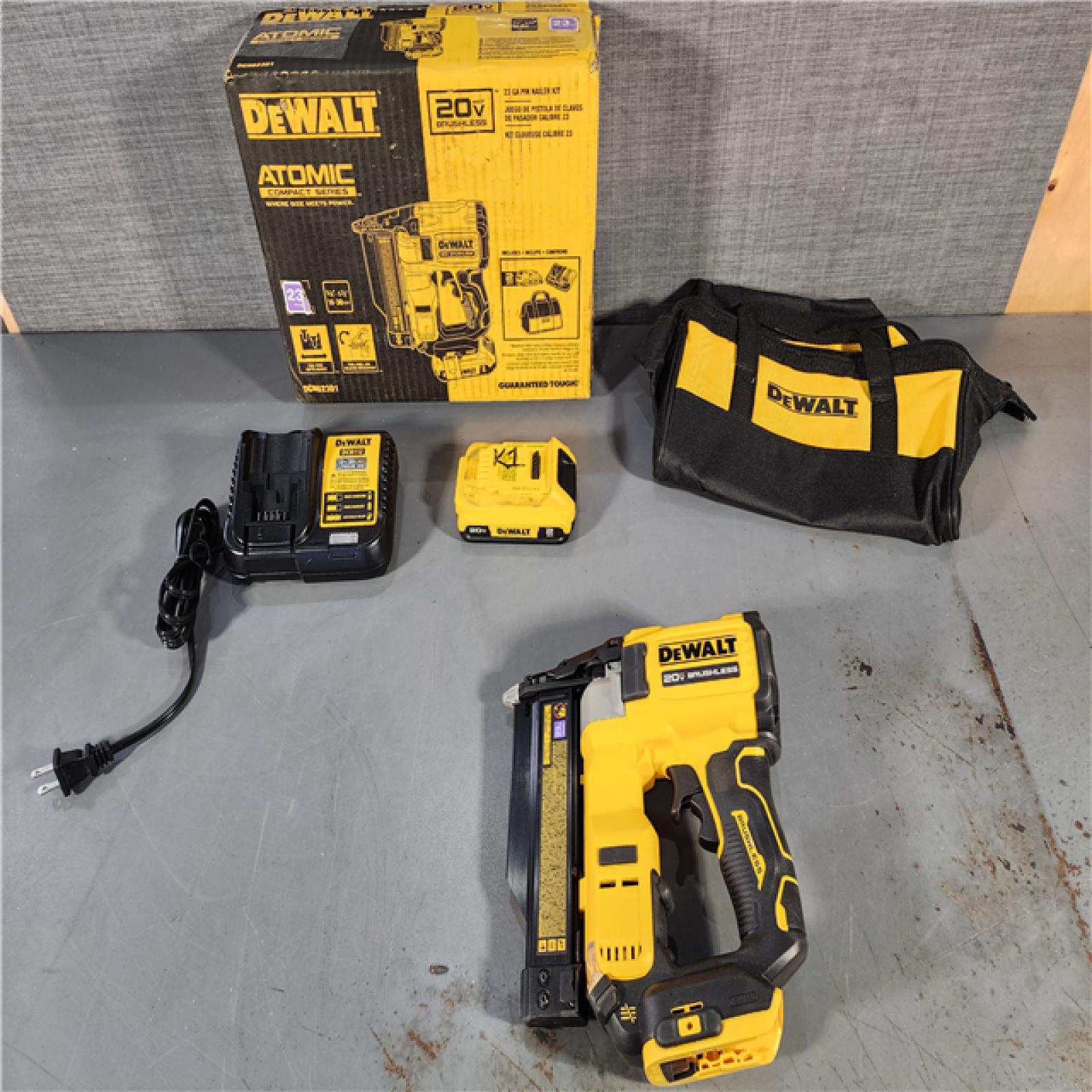 HOUSTON LOCATION - AS-IS DEWALT ATOMIC 20V MAX Lithium Ion Cordless 23 Gauge Pin Nailer Kit with 2.0Ah Battery and Charger