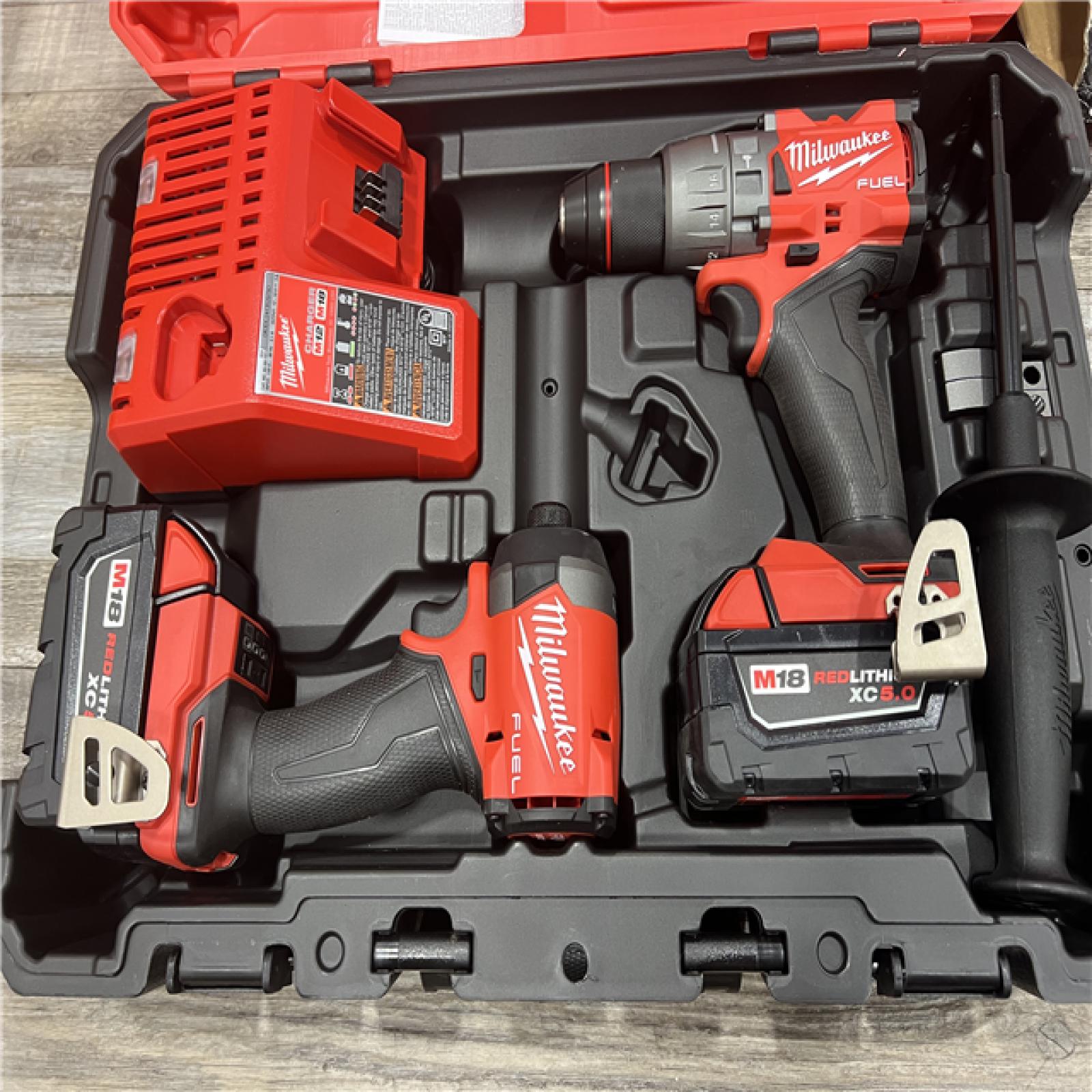 AS-IS MILWAUKEE M18 FUEL 18V Lithium-Ion Brushless Cordless Hammer Drill and Impact Driver Combo Kit (2-Tool) with 2 Batteries