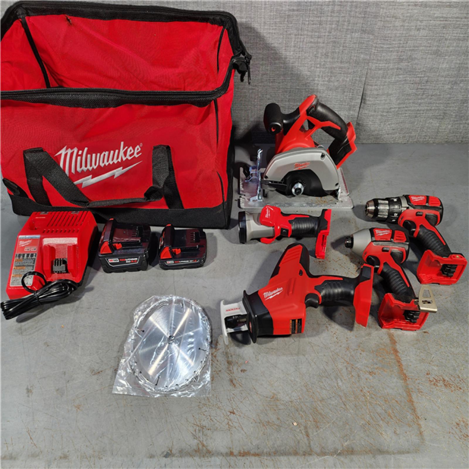 HOUSTON LOCATION - AS-IS (APPEARS LIKE NEW) Milwaukee M18 18-Volt Lithium-Ion Cordless Combo Tool Kit (5-Tool) with (1) 3.0Ah and (1) 1.5Ah Battery, (1) Charger, (1) Tool Bag