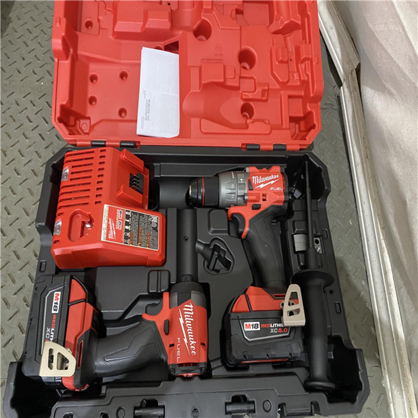 Houston location AS-IS MILWAUKEE M18 FUEL 18V Lithium-Ion Brushless Cordless Hammer Drill and Impact Driver Combo Kit (2-Tool) with 2 Batteries