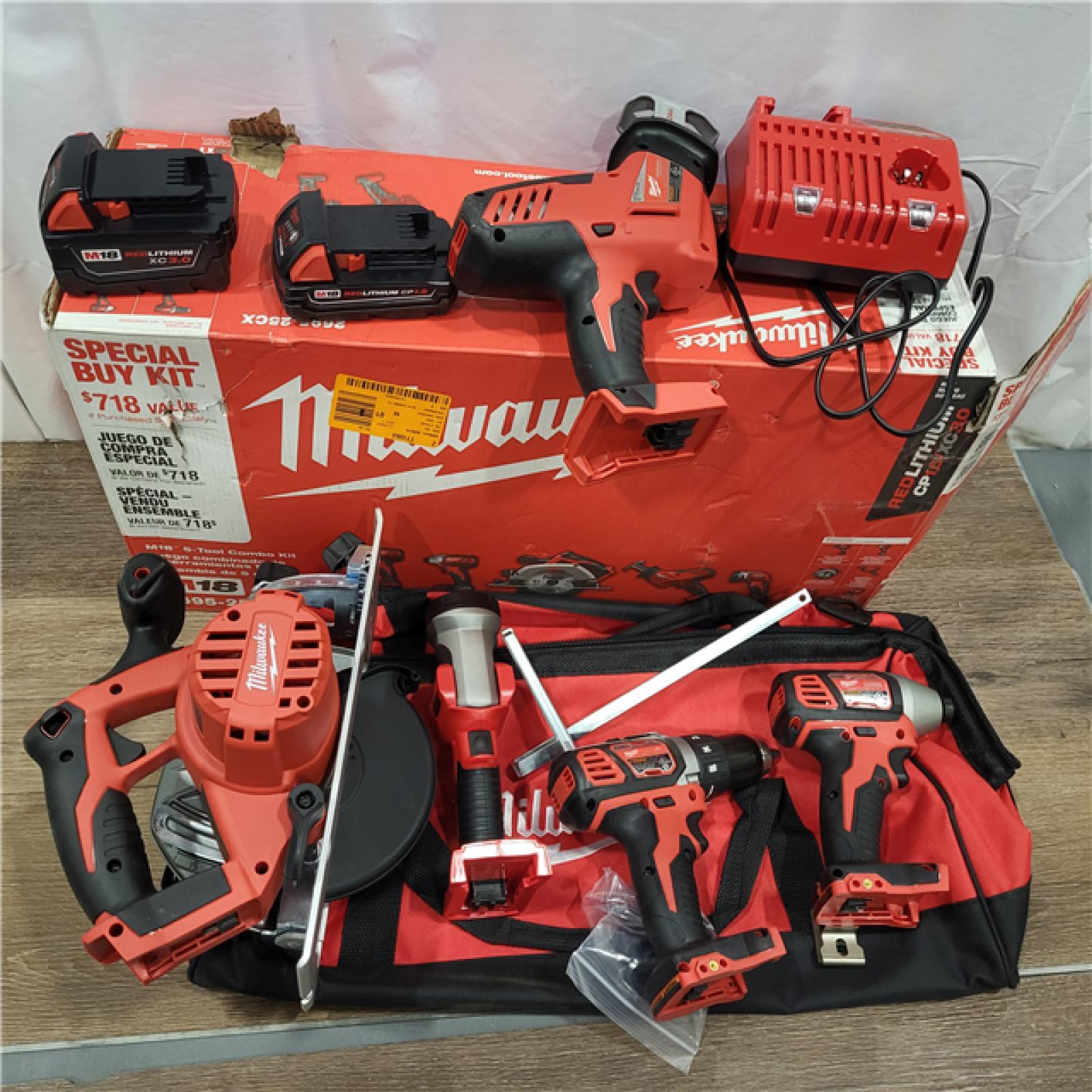 AS-IS Milwaukee M18 18-Volt Lithium-Ion Cordless Combo Tool Kit (5-Tool) with (1) 3.0Ah and (1) 1.5Ah Battery, (1) Charger, (1) Tool Bag