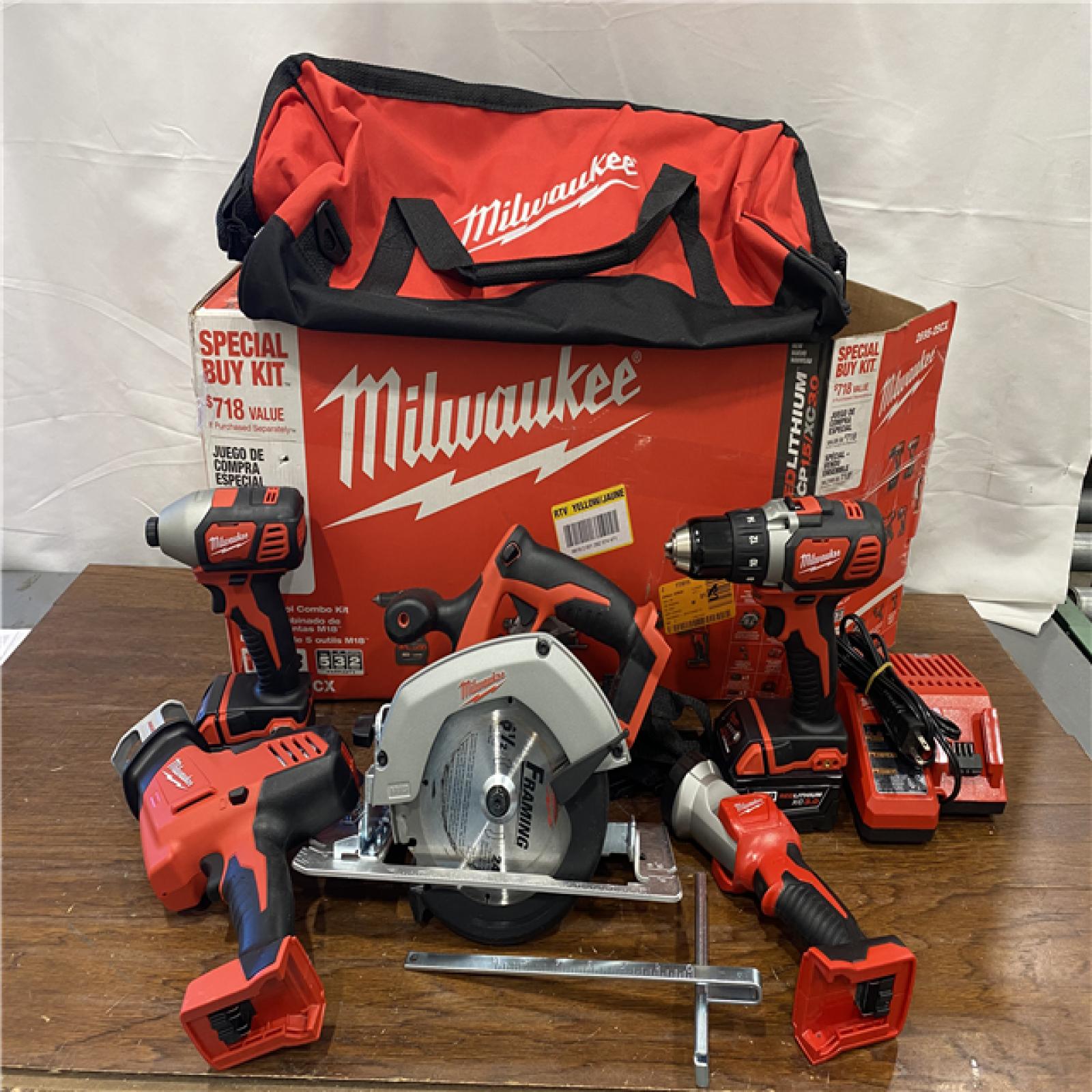 AS-IS Milwaukee M18 18-Volt Lithium-Ion Cordless Combo Tool Kit (5-Tool) with (1) 3.0Ah and (1) 1.5Ah Battery, (1) Charger, (1) Tool Bag