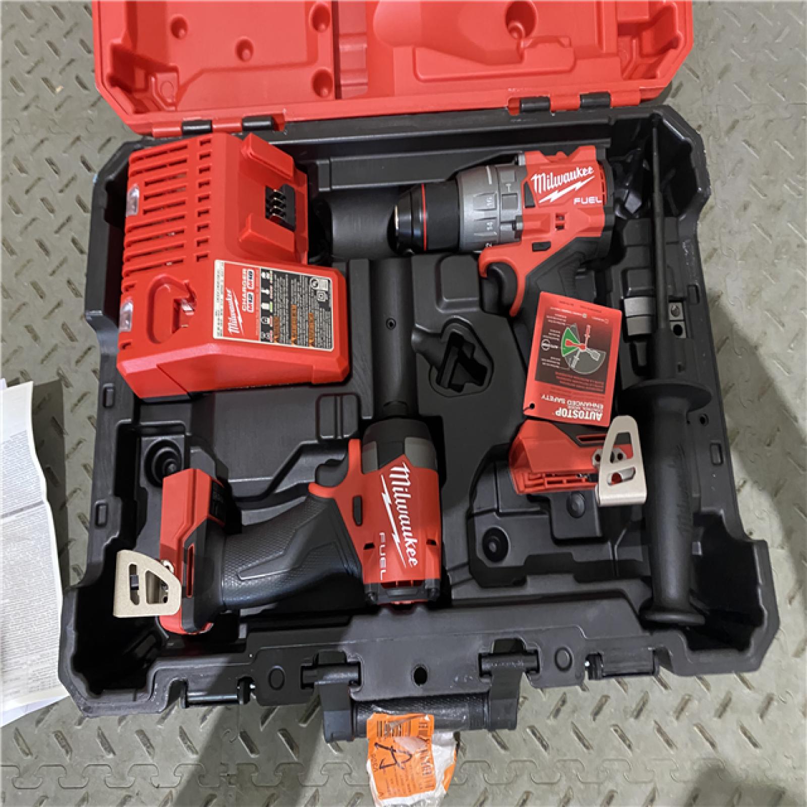 Houston location AS-IS Milwaukee 3697-22 M18 FUEL 1/2 Hammer Driller/Driver &1/4 Hex Impact Driver 2 Tool Combo NO BATTERY ONLY TOOL IN CHARGER