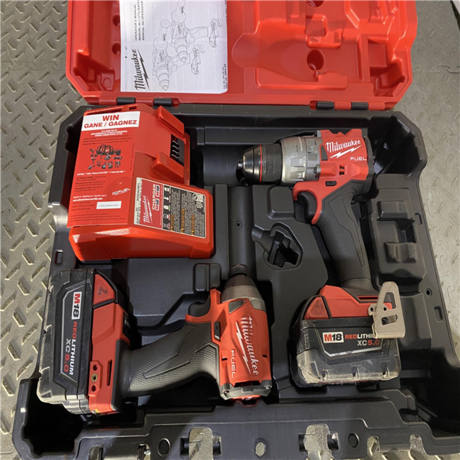 Houston location AS-IS Milwaukee 3697-22 M18 FUEL 1/2 Hammer Driller/Driver &1/4 Hex Impact Driver 2 Tool Combo Kit