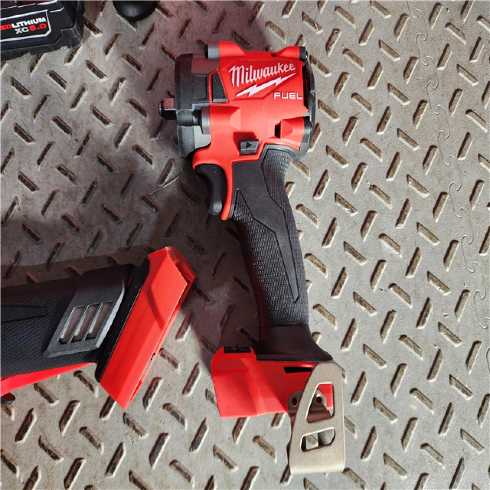 HOUSTON LOCATION - AS-IS M18 FUEL 18V Lithium-Ion Brushless Cordless Grinder & 3/8 in. Impact Wrench Combo Kit (2-Tool) W/ Two 5Ah Batteries