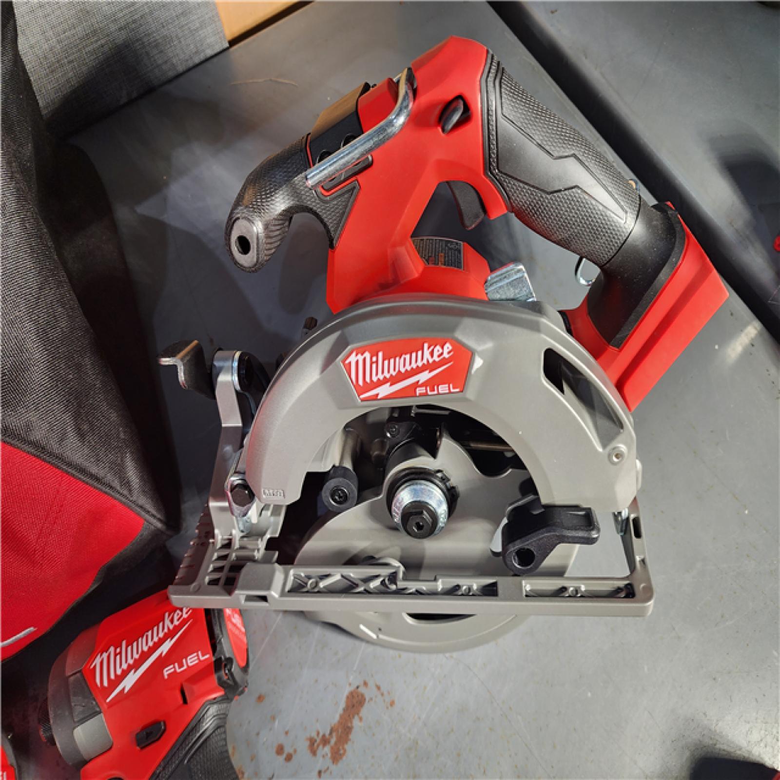 HOUSTON LOCATION - AS-IS Milwaukee M18 FUEL 18V Lithium-Ion Brushless Cordless Combo Kit with Two 5.0 Ah Batteries  1 Charger  2 Tool Bags (7-Tool)