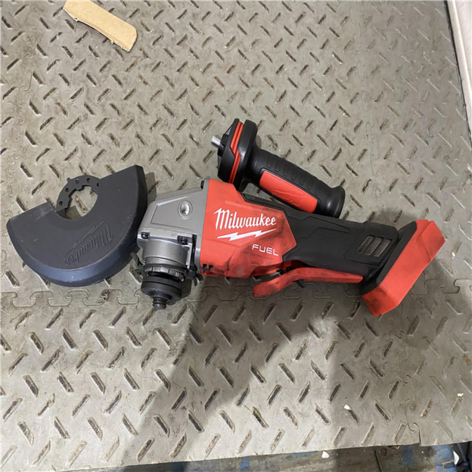 Houston location AS-IS Milwaukee 2880-20 M18 FUEL 18-Volt Lithium-Ion Brushless Cordless 4-1/2 in./5 in. Grinder W/Paddle Switch (Tool-Only)