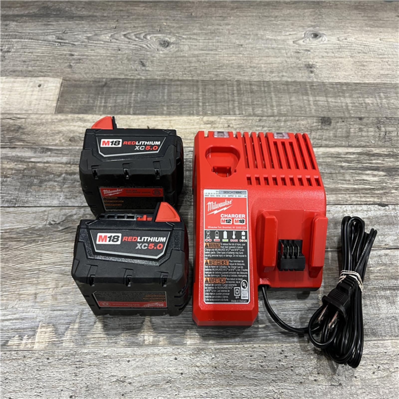 AS-IS Milwaukee M18 18-Volt Lithium-Ion XC Starter Kit with Two 5.0Ah Batteries / Charger (48-59-1852B)