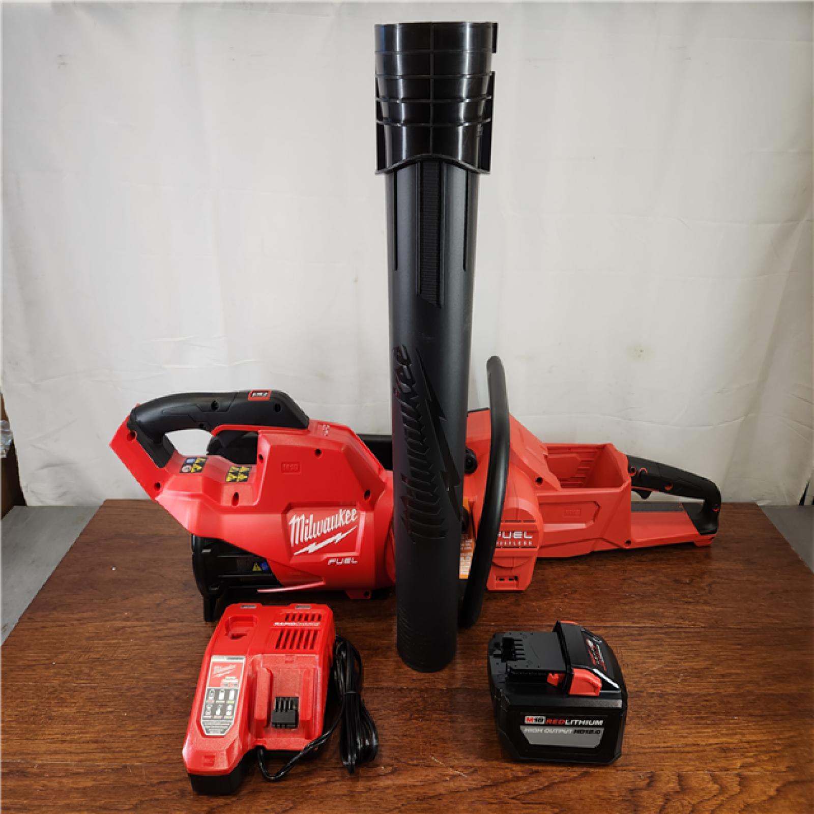 Like-New Milwaukee M18 FUEL 18V Brushless Cordless 16 in. Chainsaw Kit w/ M18 GEN II FUEL Blower