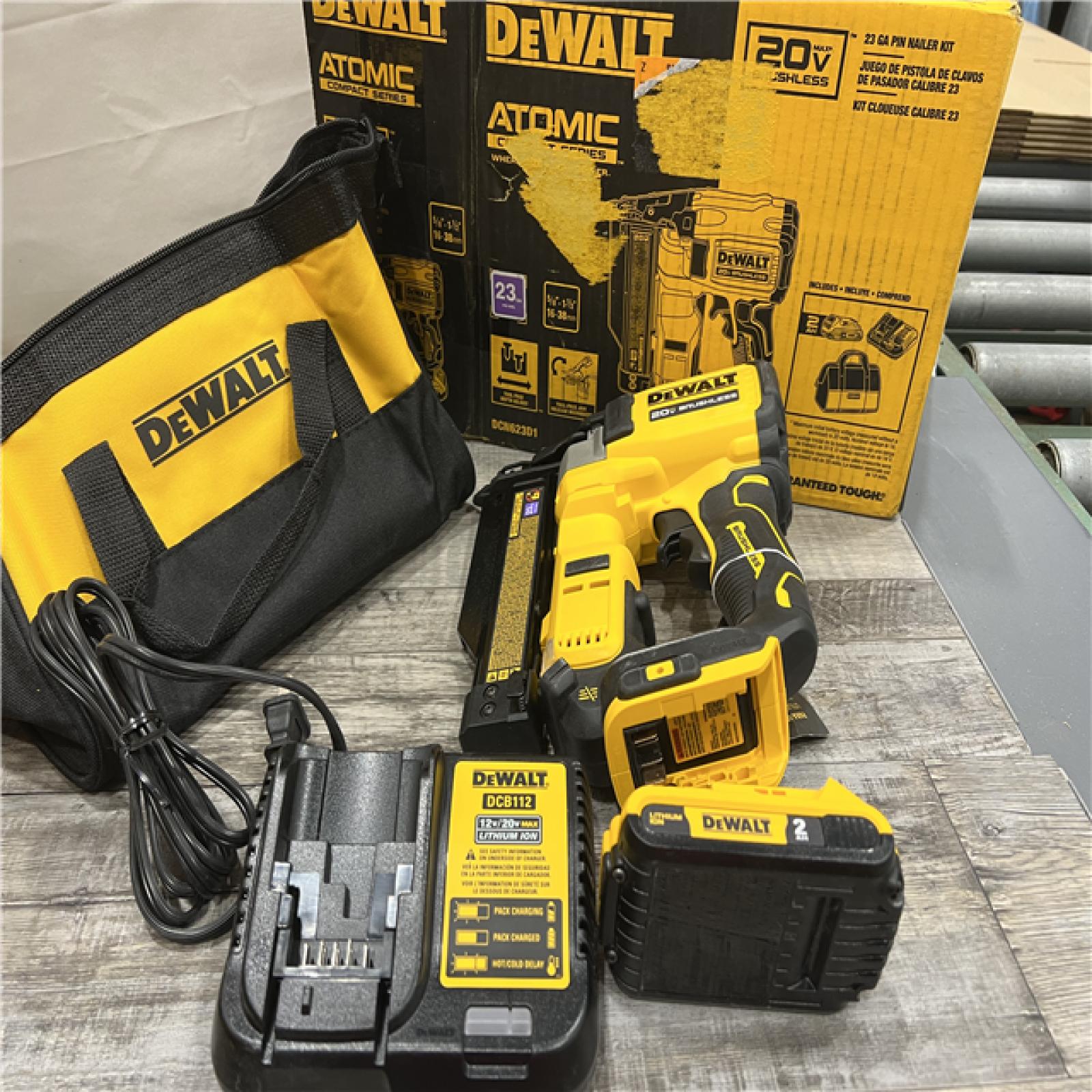 AS-IS DEWALT ATOMIC 20V MAX Lithium Ion Cordless 23 Gauge Pin Nailer Kit with 2.0Ah Battery and Charger