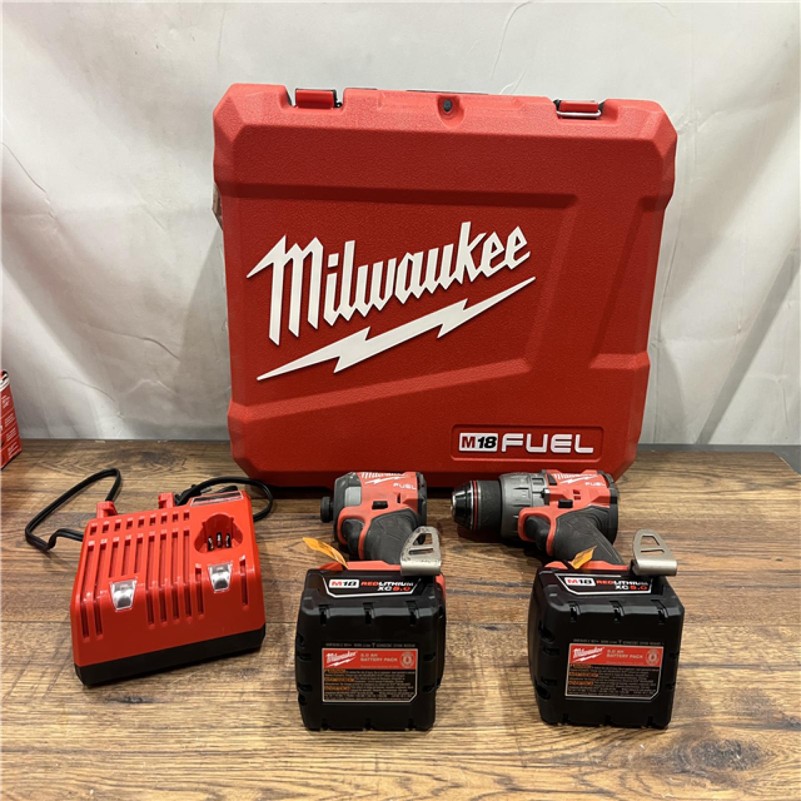 AS-IS Milwaukee M18 FUEL 18V Lithium-Ion Brushless Cordless Hammer Drill and Impact Driver Combo Kit (2-Tool) with 2 Batteries