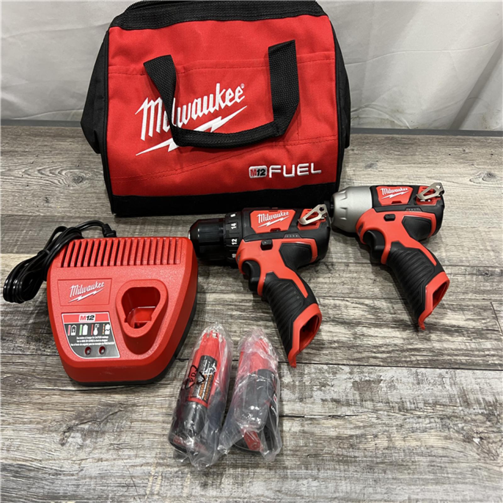 AS-IS MILWAUKEE M12 12V Lithium-Ion Cordless Drill Driver/Impact Driver Combo Kit with Two 1.5Ah Batteries, Charger and Bag (2-Tool)